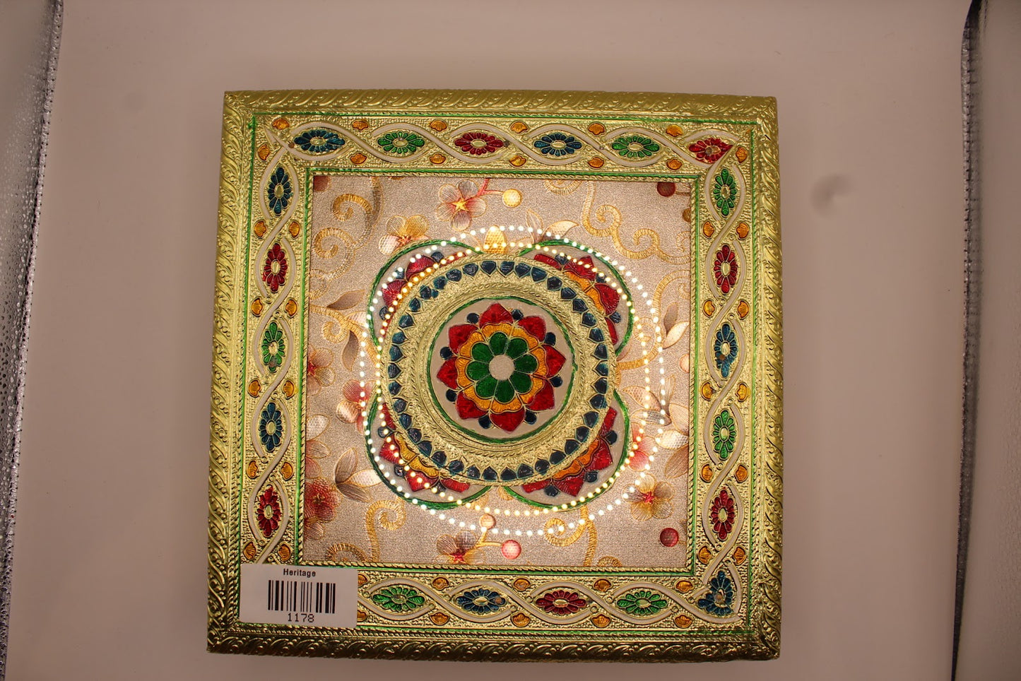 Floral meenakari chowki close-up of enamel and pearl bead detail
