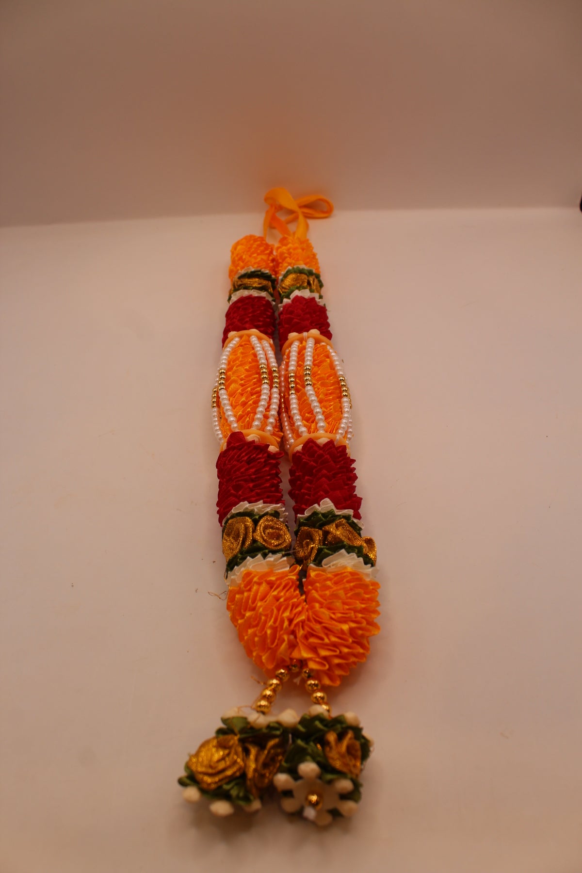 Yellow and red garland mala, front