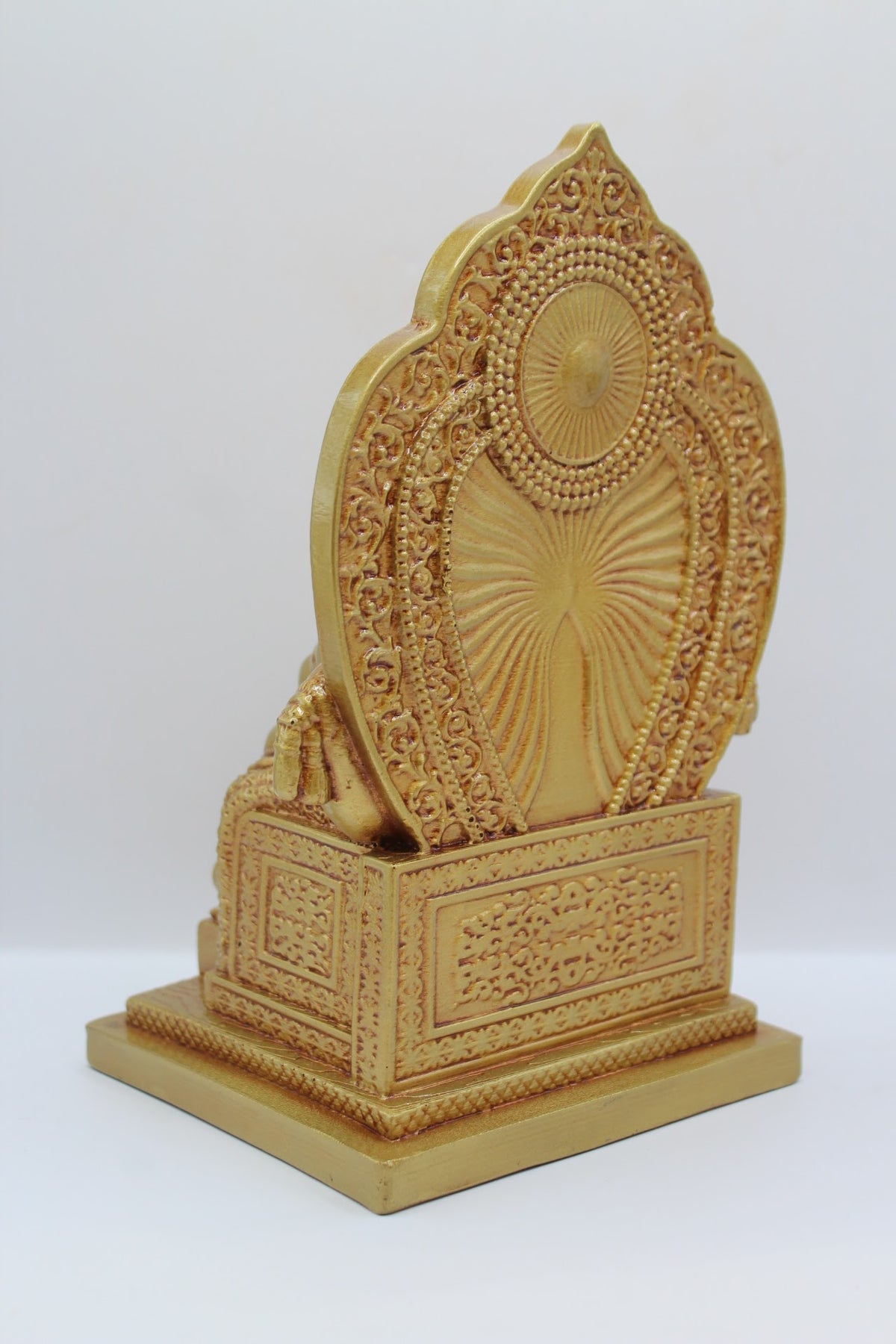 Gold resin Kuber murti seated on a throne, back view
