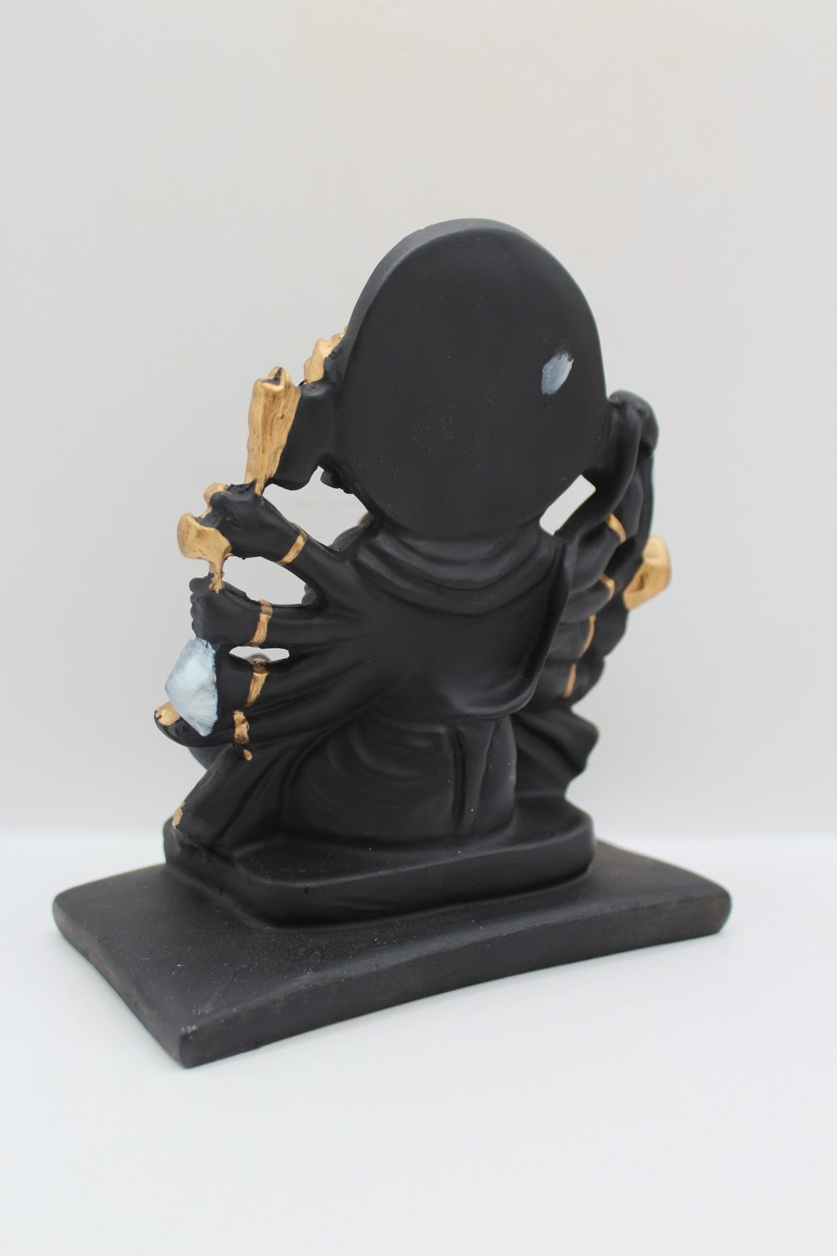 Black and gold resin Panchmukhi Hanuman murti, back view