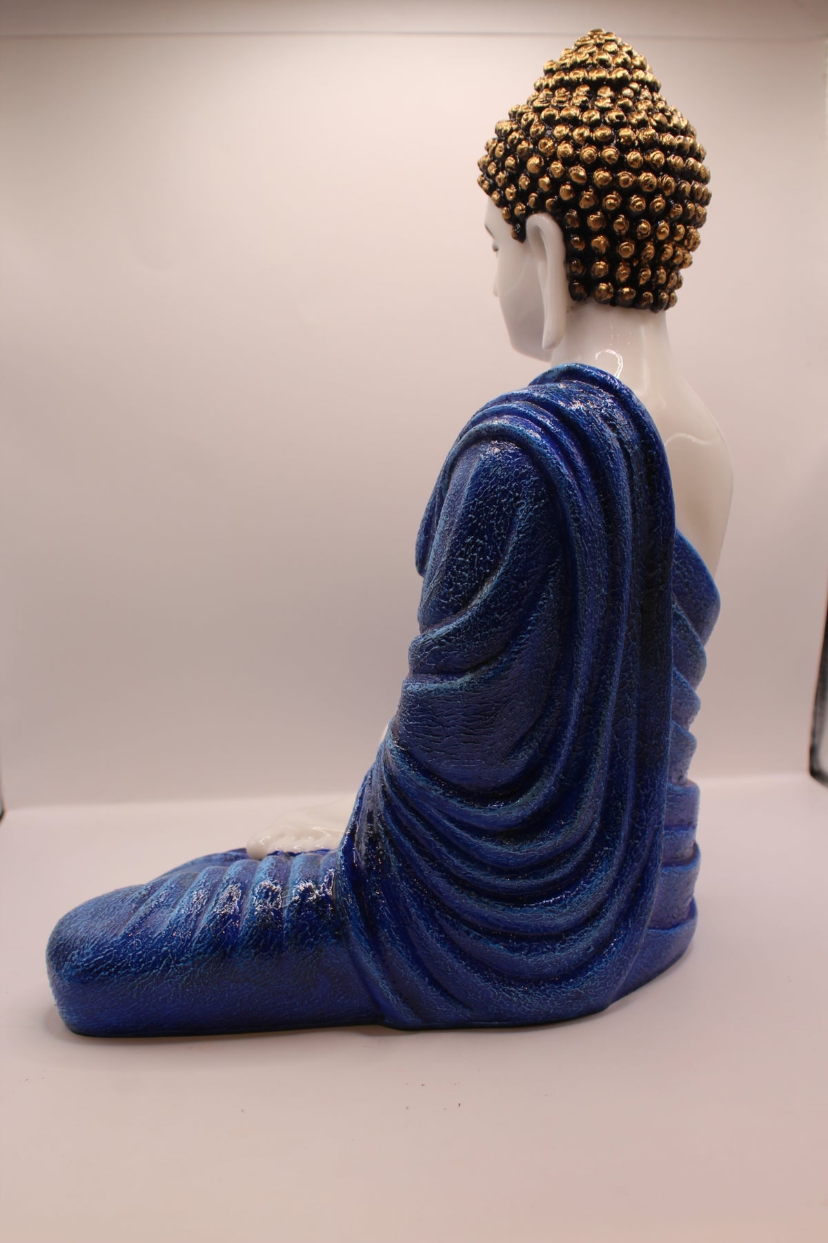 Pastel blue Buddha statue, back