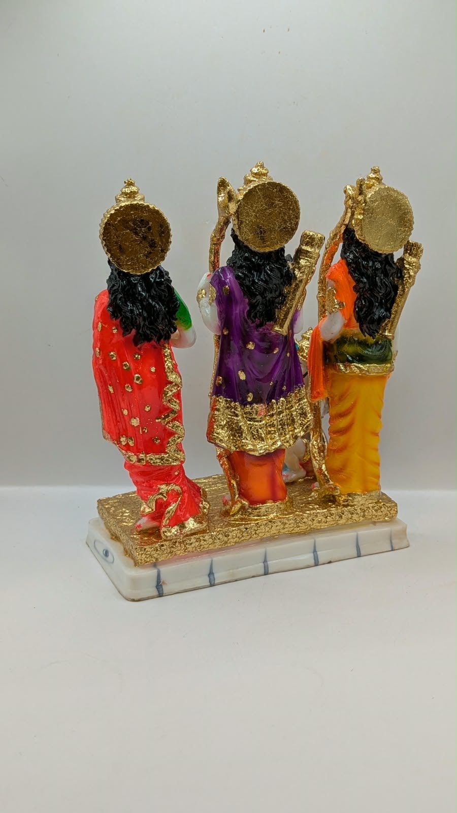Colourful Ram Darbar statue with gold base, back view