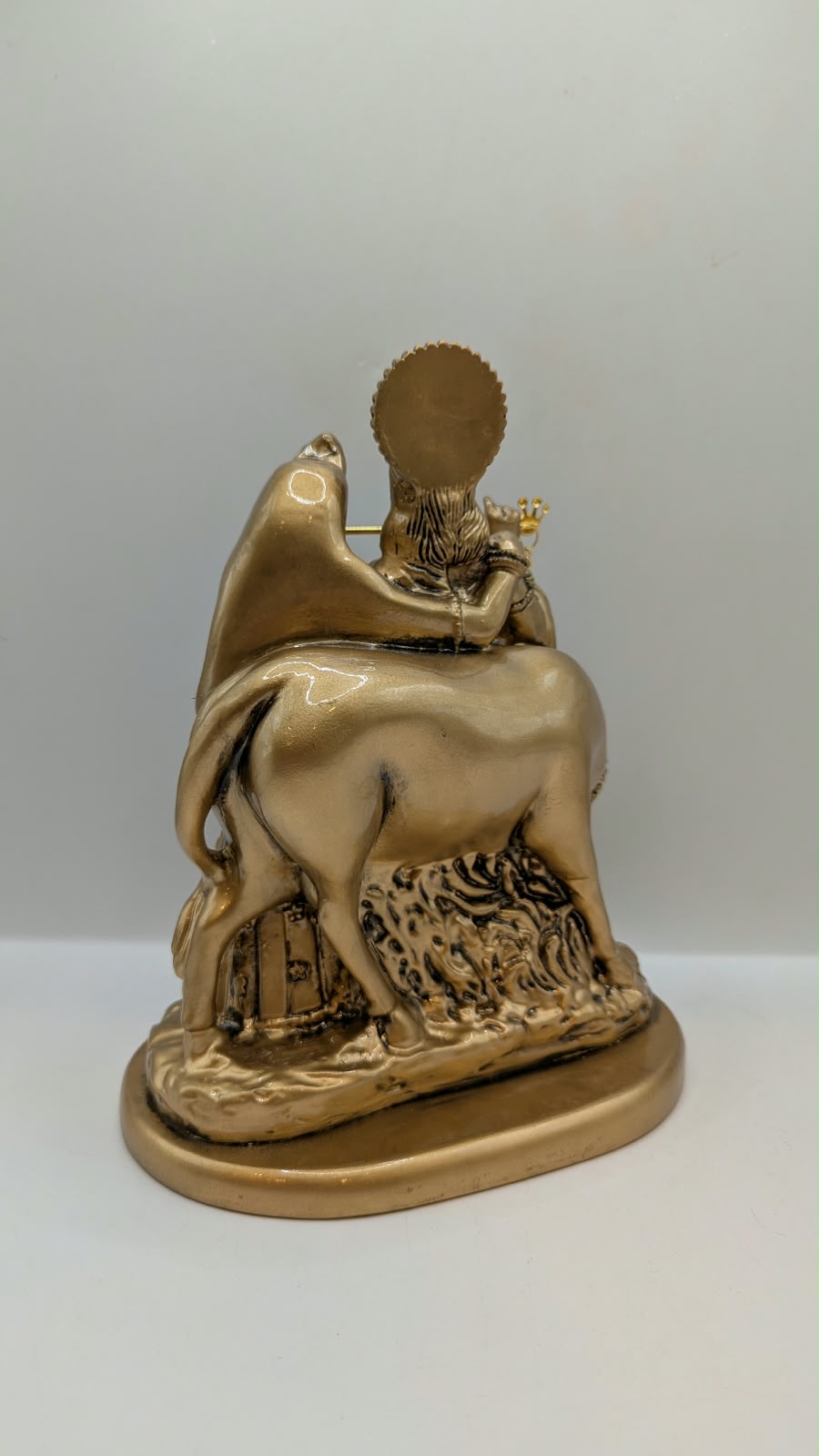 Antique gold Radha Krishna with cow statue, back view