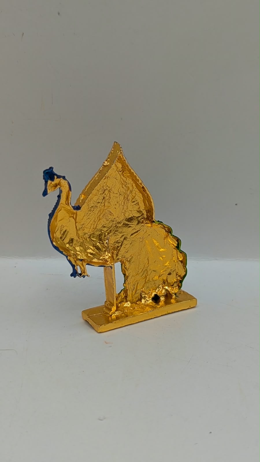 Gold Murugan Vel with peacock, back view