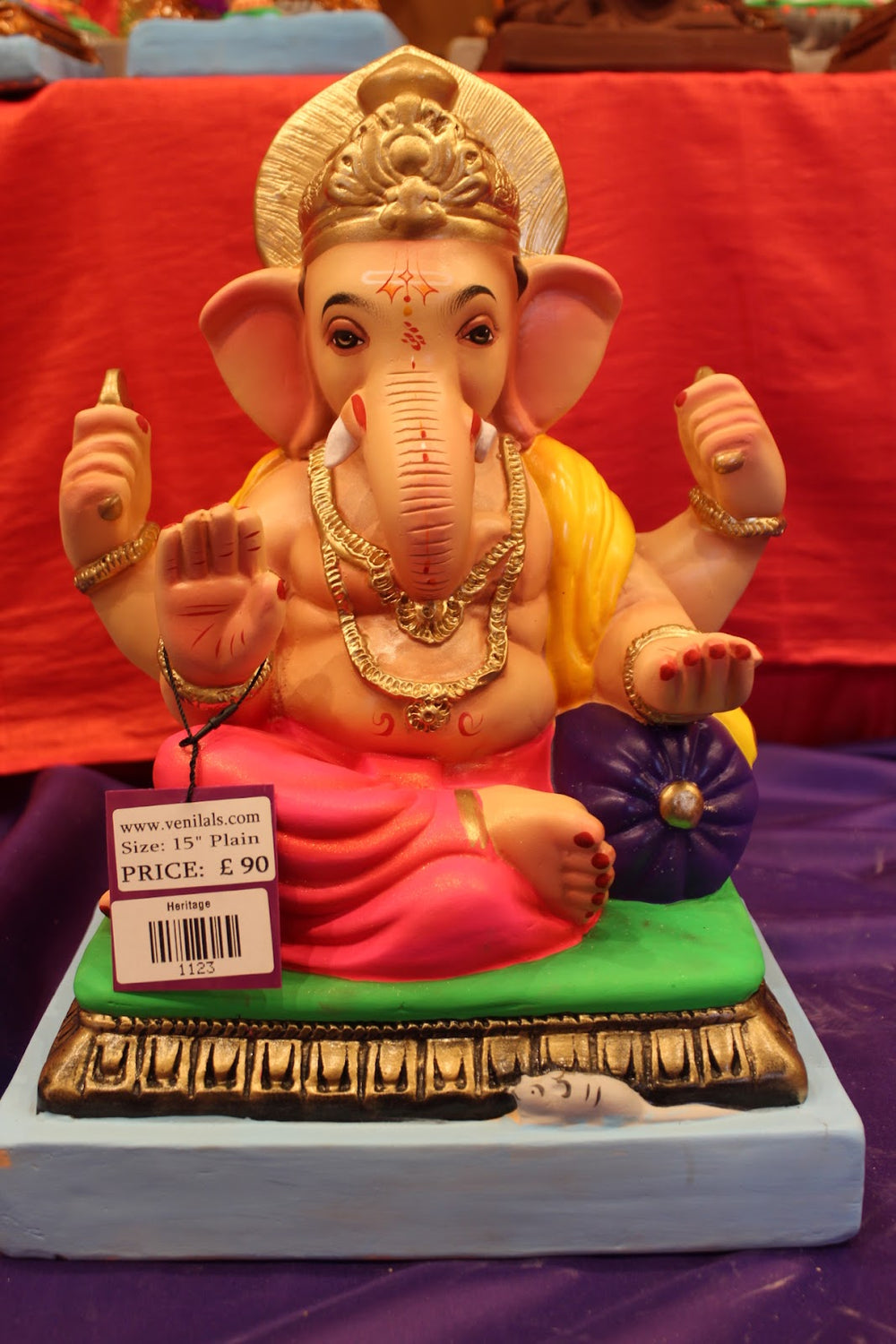 Plain hand-painted eco-friendly Ganesh idol with yellow khes and pink dhoti