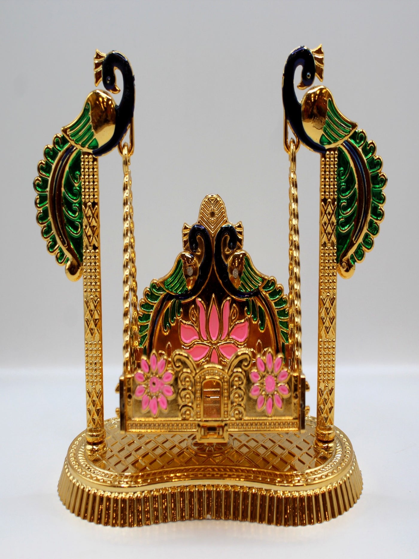 Bal Gopal jhula with green peacock posts and a pink lotus seat