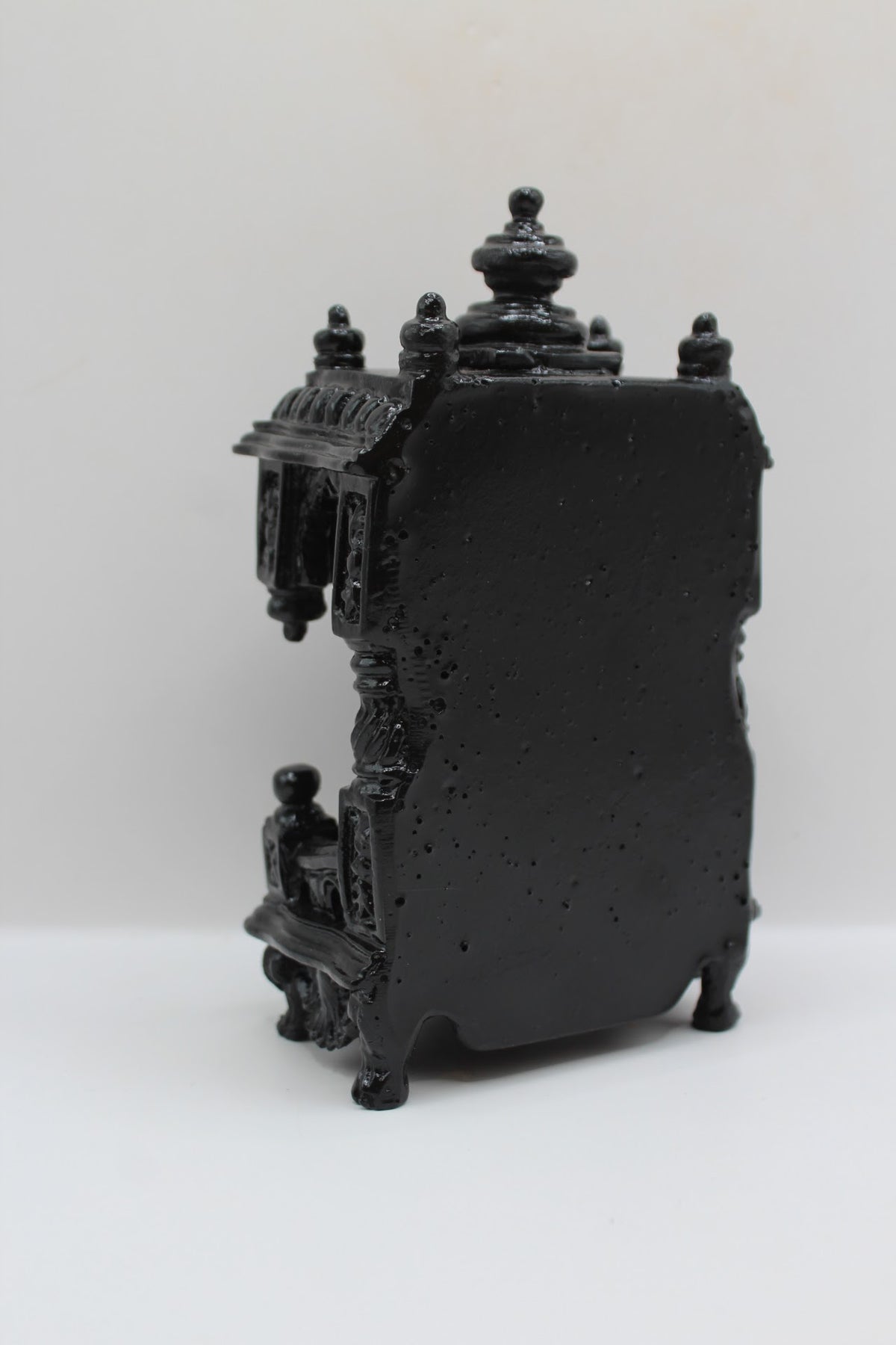 Small black mandir, back view