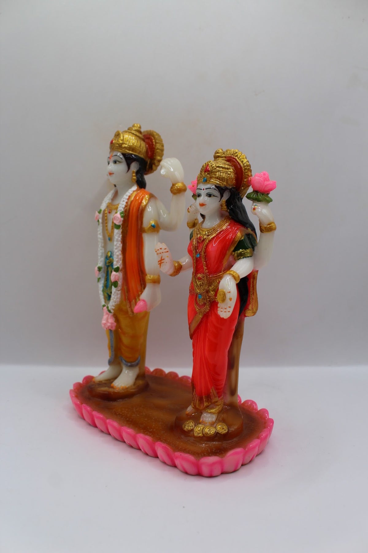 Colourful resin Vishnu Laxmi murti, standing on lotus base, right side view