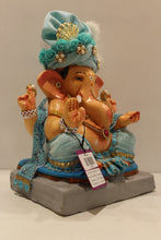 Load image into Gallery viewer, Eco-friendly clay Ganesh idol with sky blue safa and pearls, side view