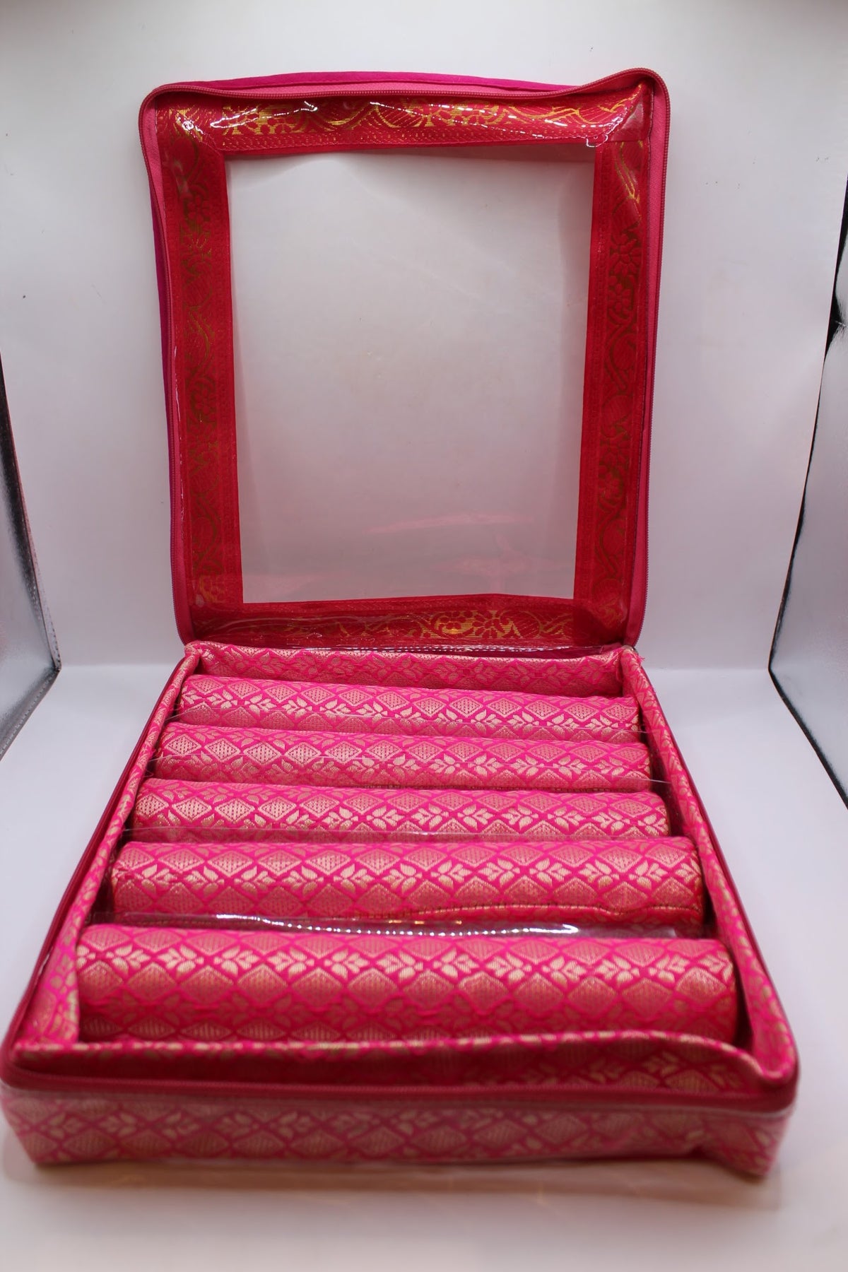 Pink bangle box with 5 rolls – open