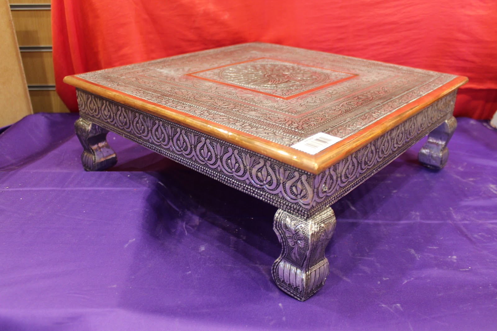 Oxidised silver bajot pooja chowki angled view with carved scrolled legs