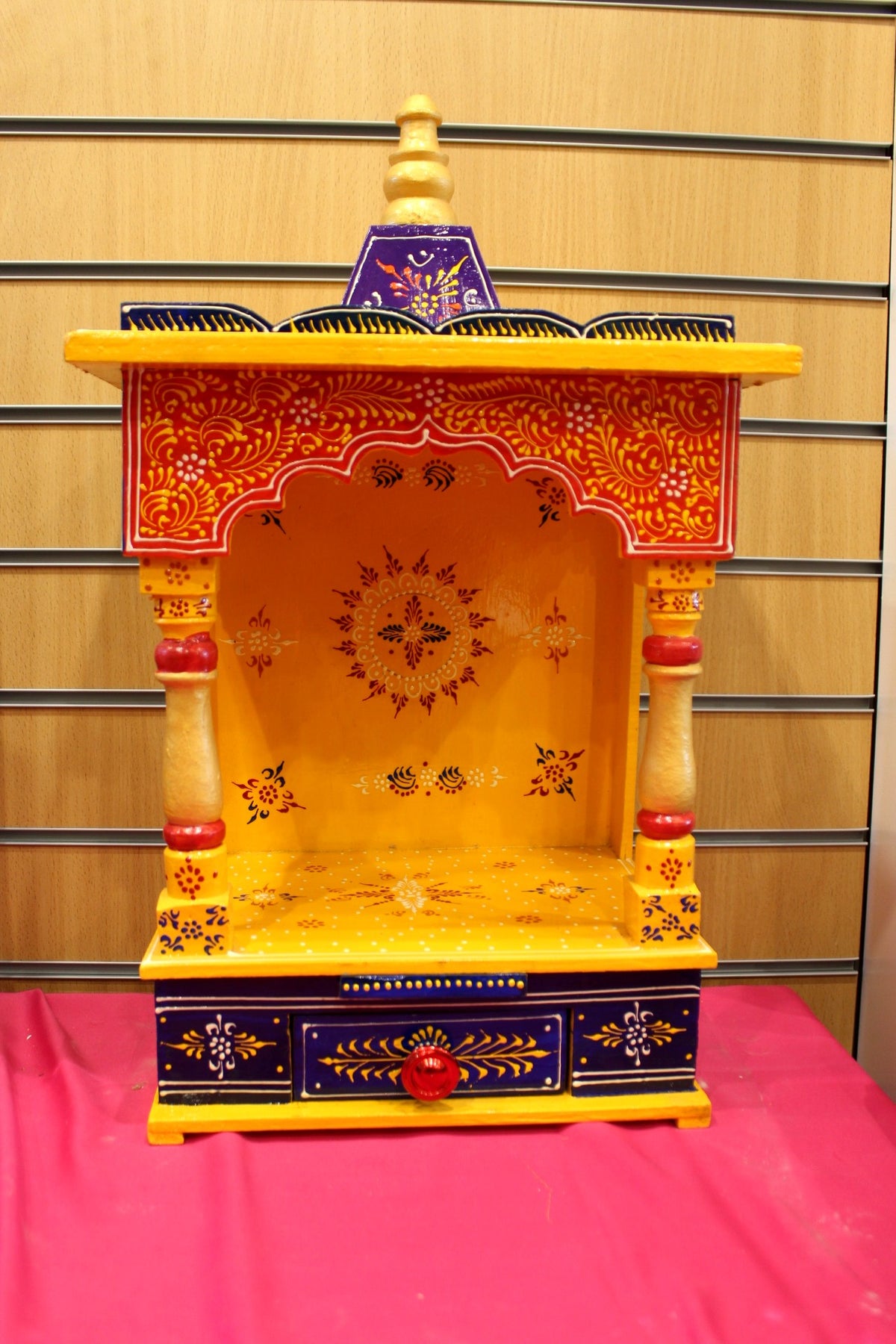 Marigold yellow hand-painted Jaipuri mandir with blue domed canopy, front view