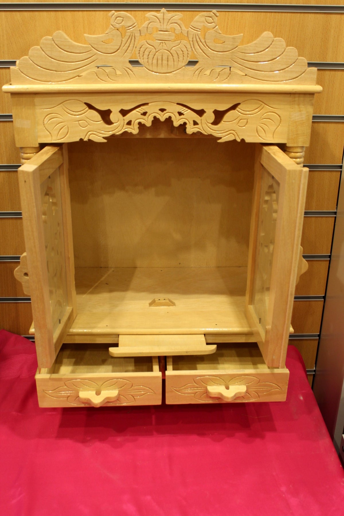 Two base drawers of the Sevan wood mandir pulled open