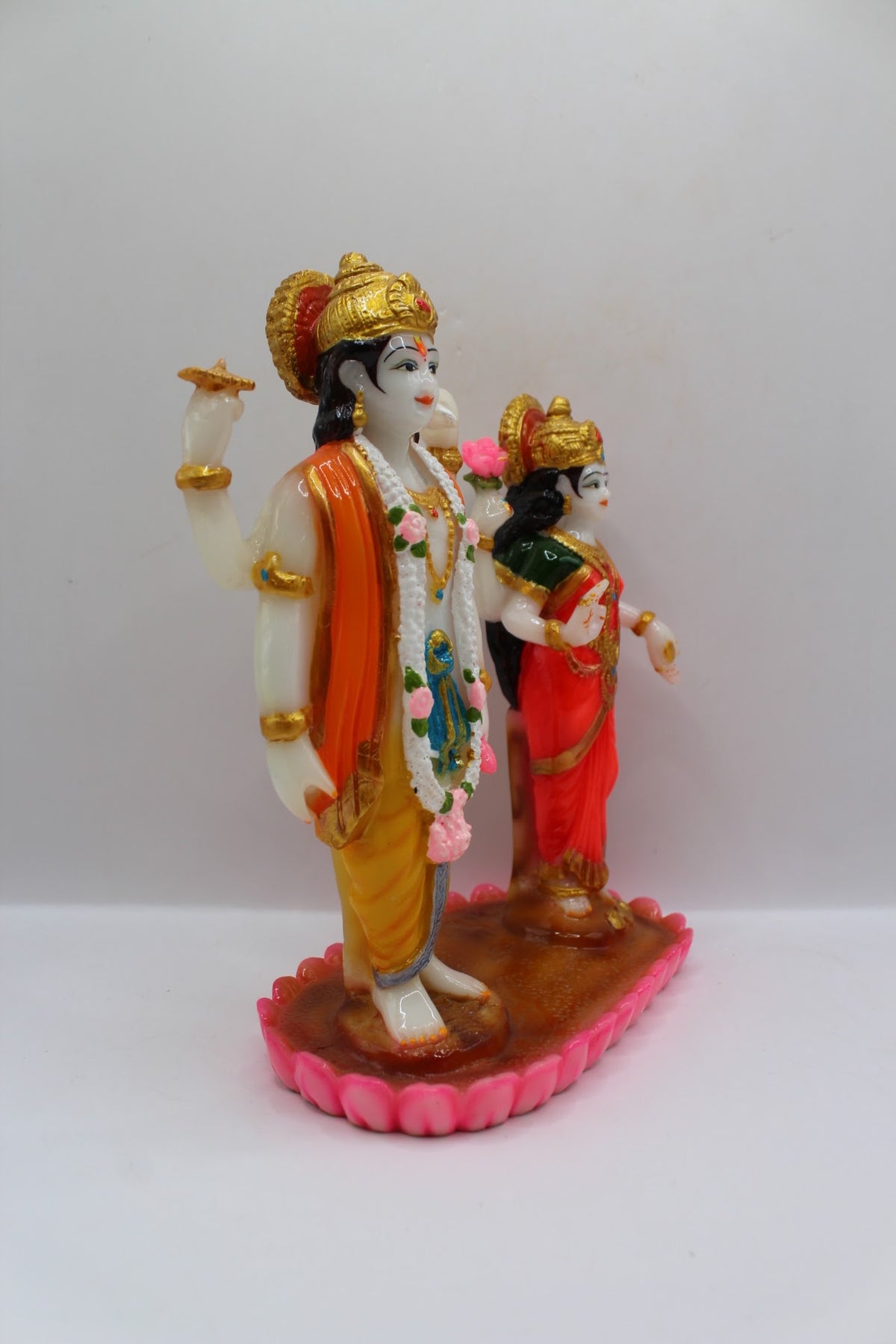 Colourful resin Vishnu Laxmi murti, standing on lotus base, left side view