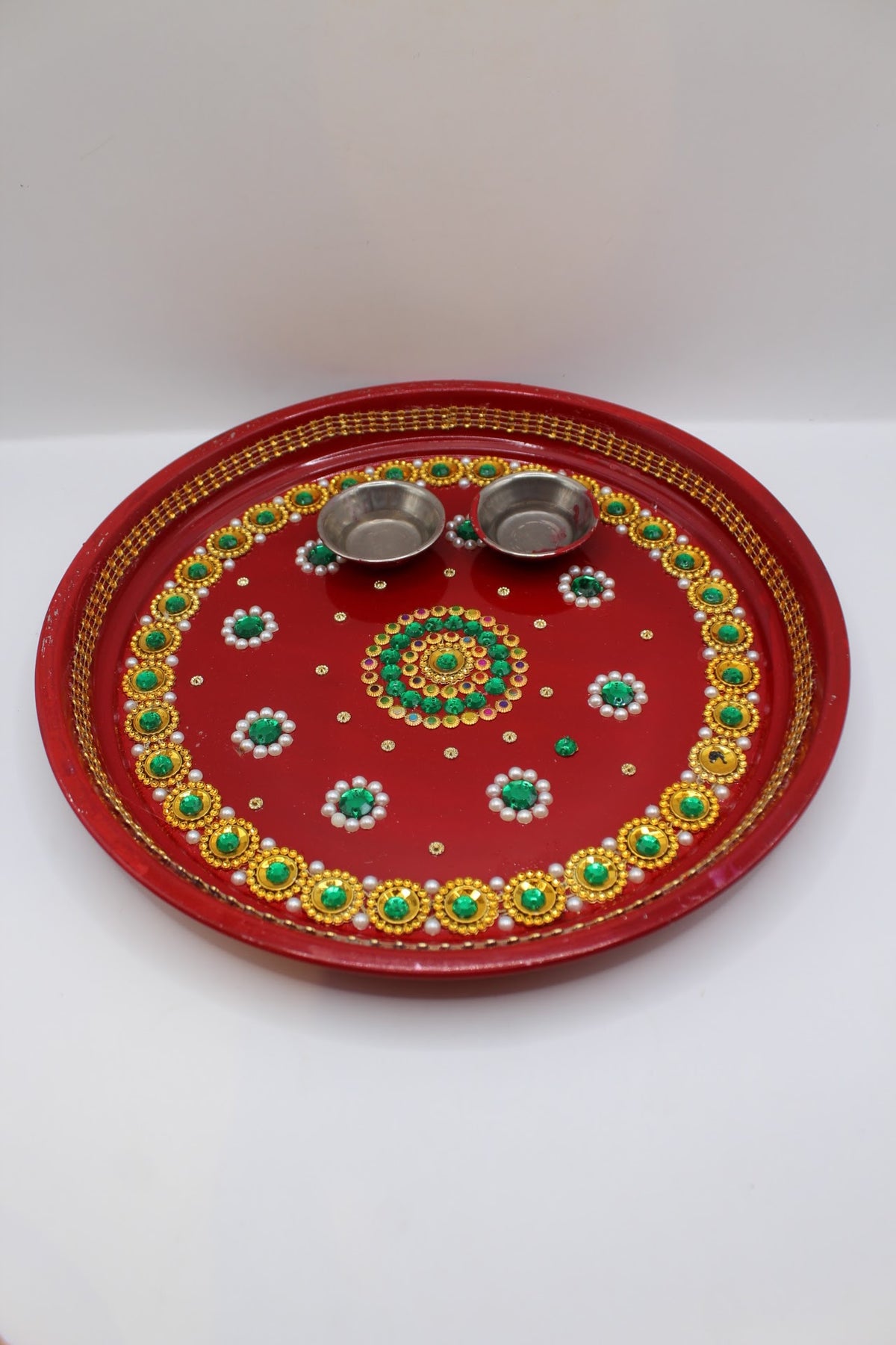 Red Karwa Chauth set with gold and green stones, thali, channi and lota, front view