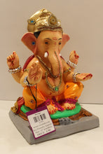 Load image into Gallery viewer, Eco-friendly clay Ganesh idol in jewellery style with blue gem crown, side view