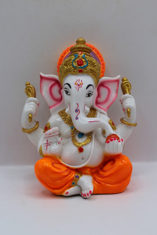 White resin Ganesh murti, orange dhoti, front view