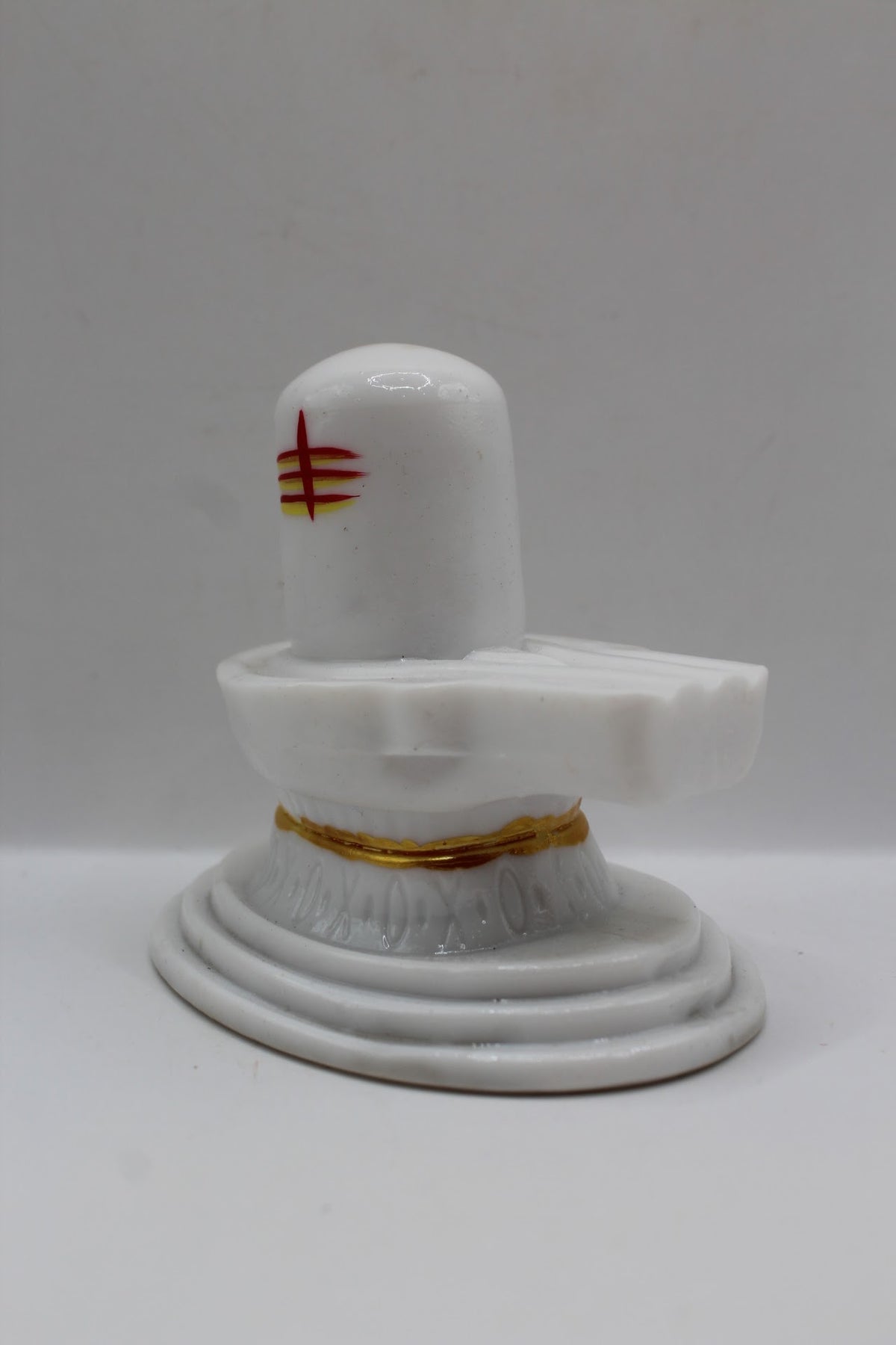 White resin Shivling with tripundra, right side view