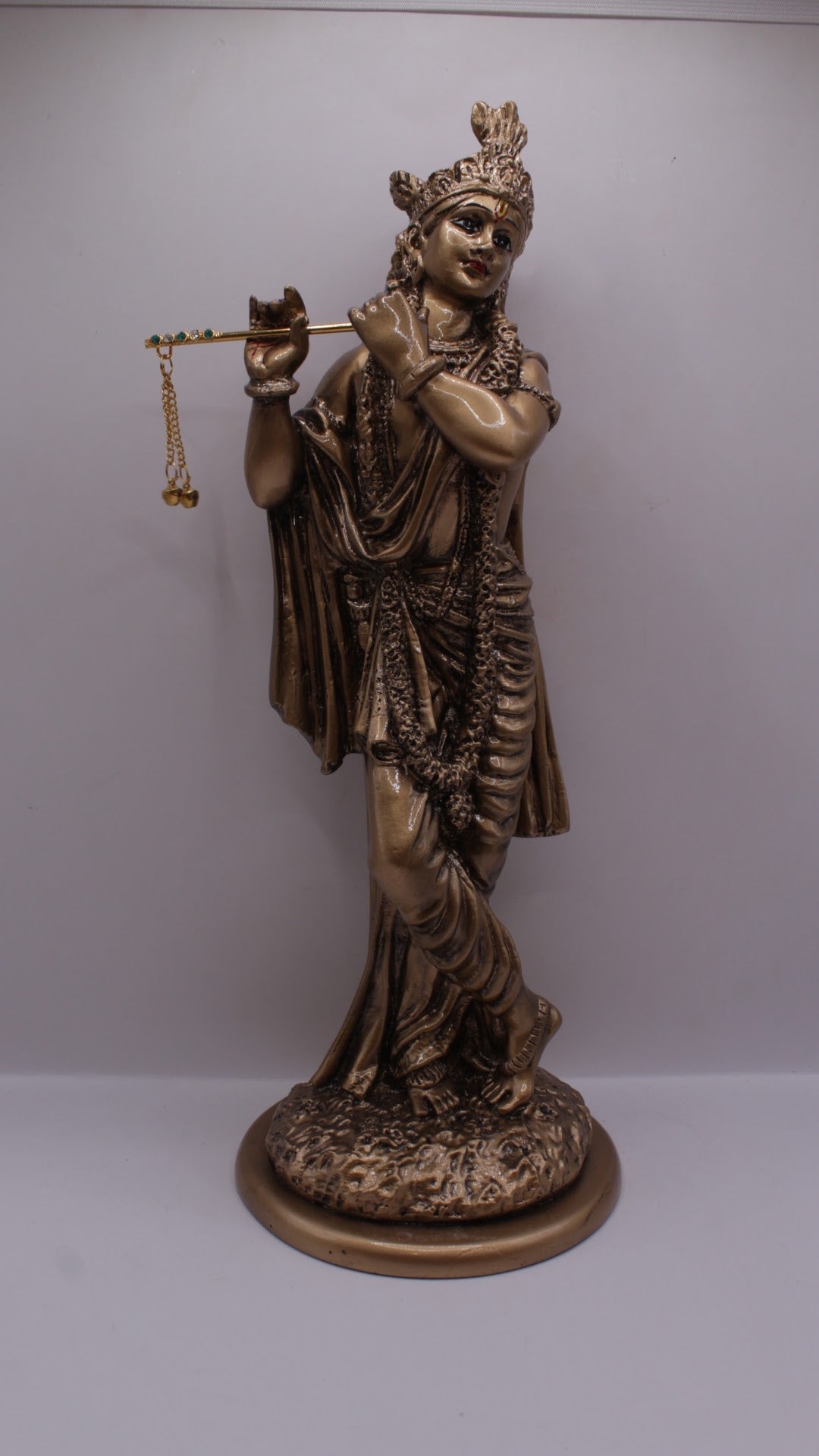 Antique bronze resin Krishna statue playing flute, front view