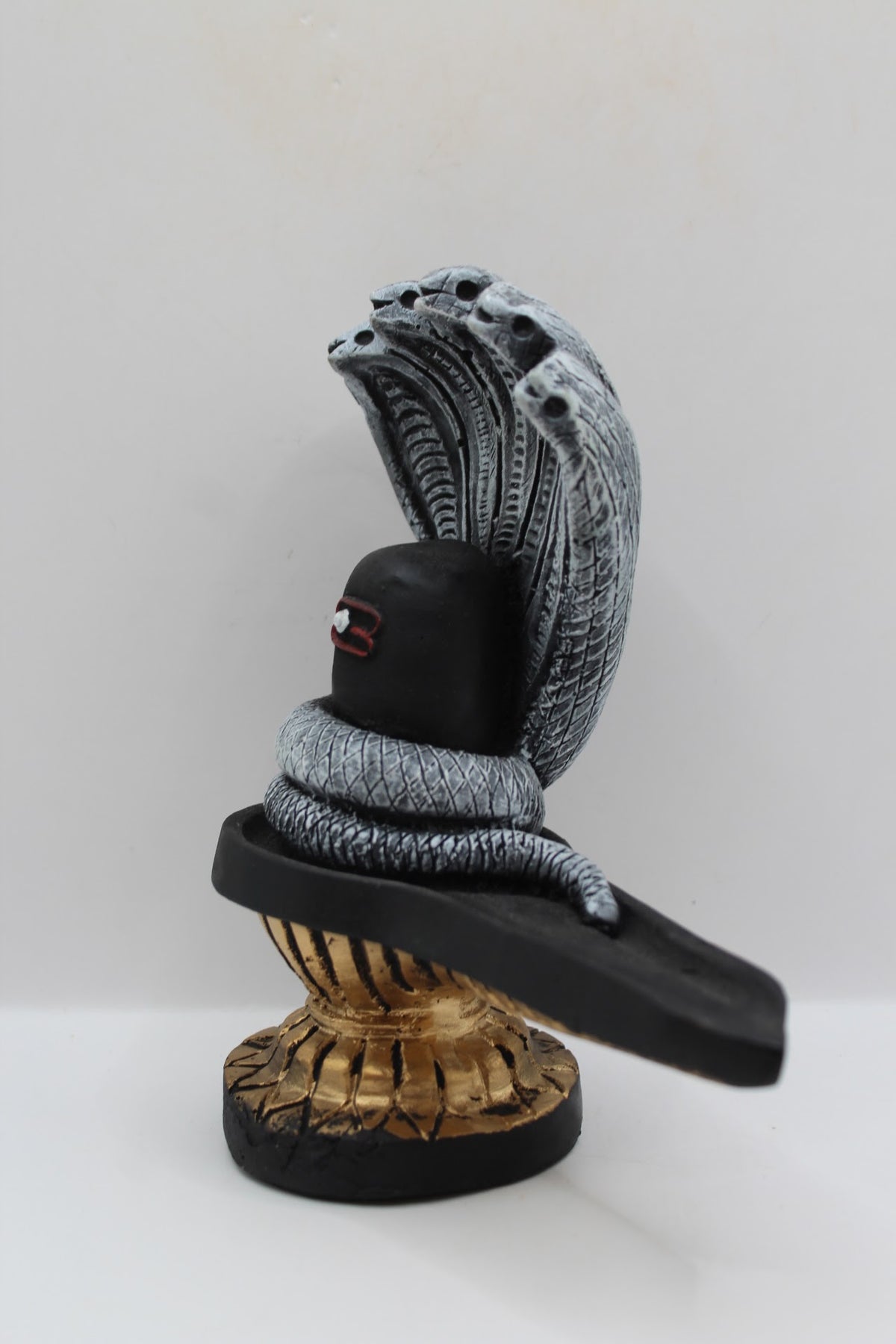 Black resin Shivling with Sheshnaag, right side view