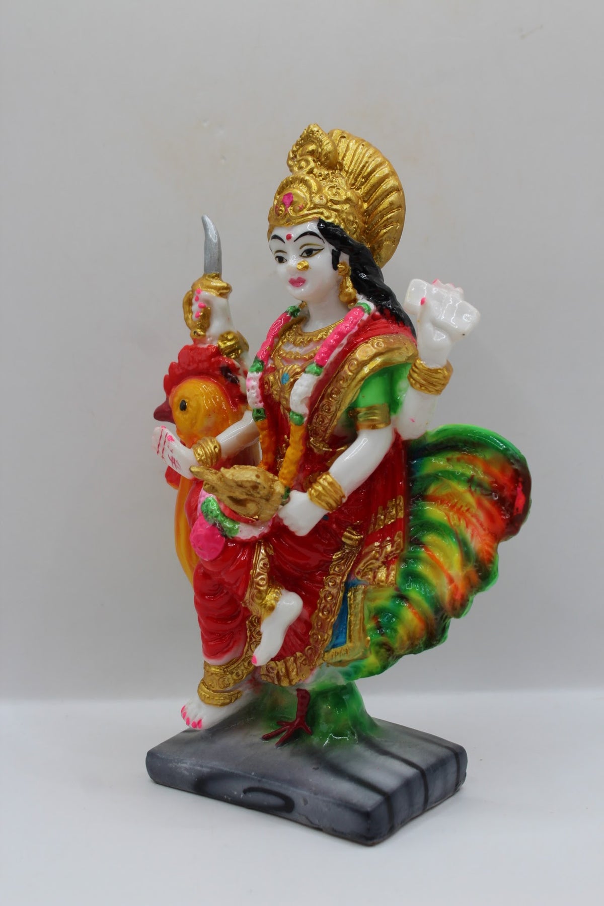 Resin Bahuchar Maa murti riding a rooster, right side view
