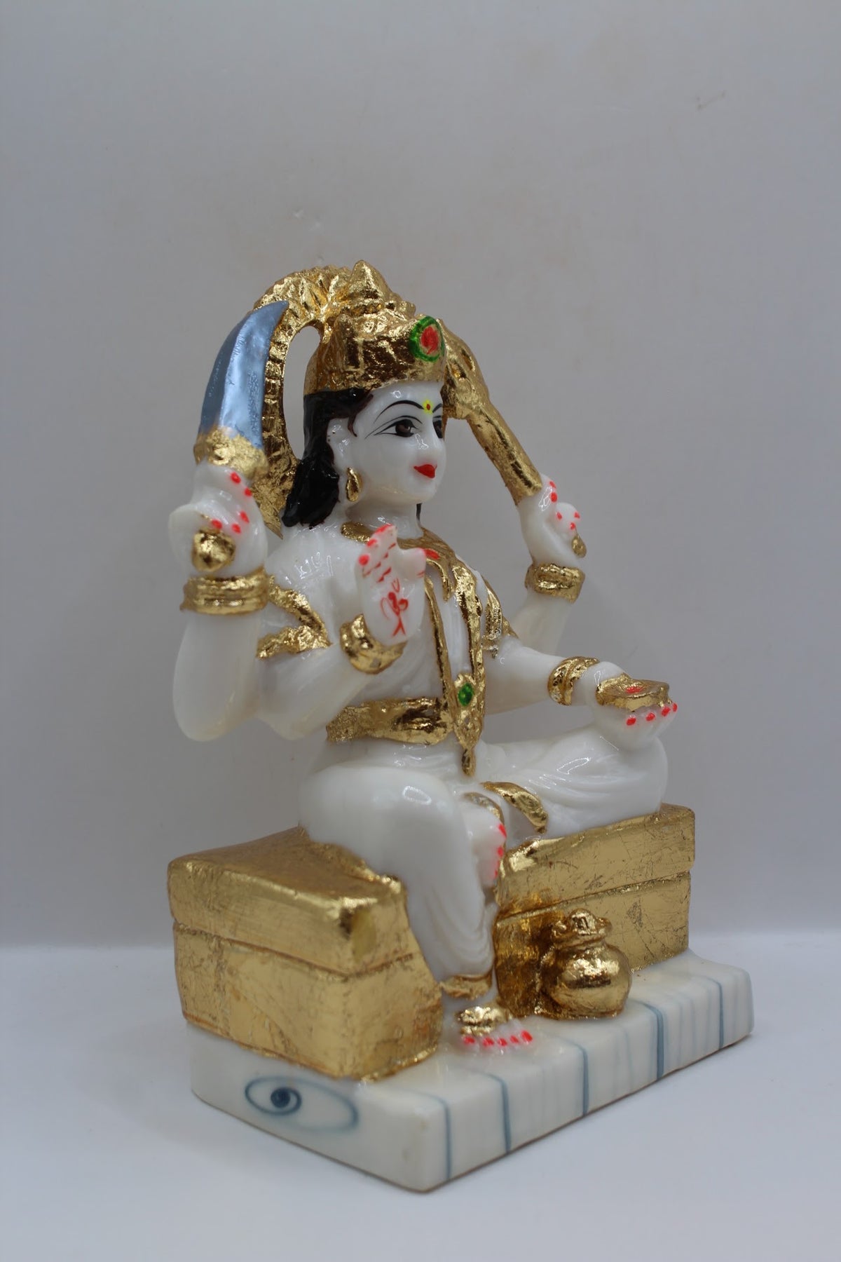 White and gold resin Santoshi Maa murti, left side view