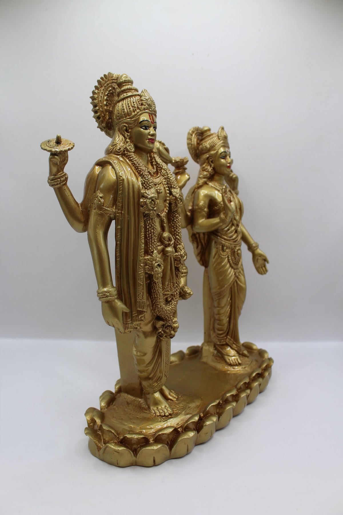 Gold resin Vishnu Laxmi murti, standing pair, left side view