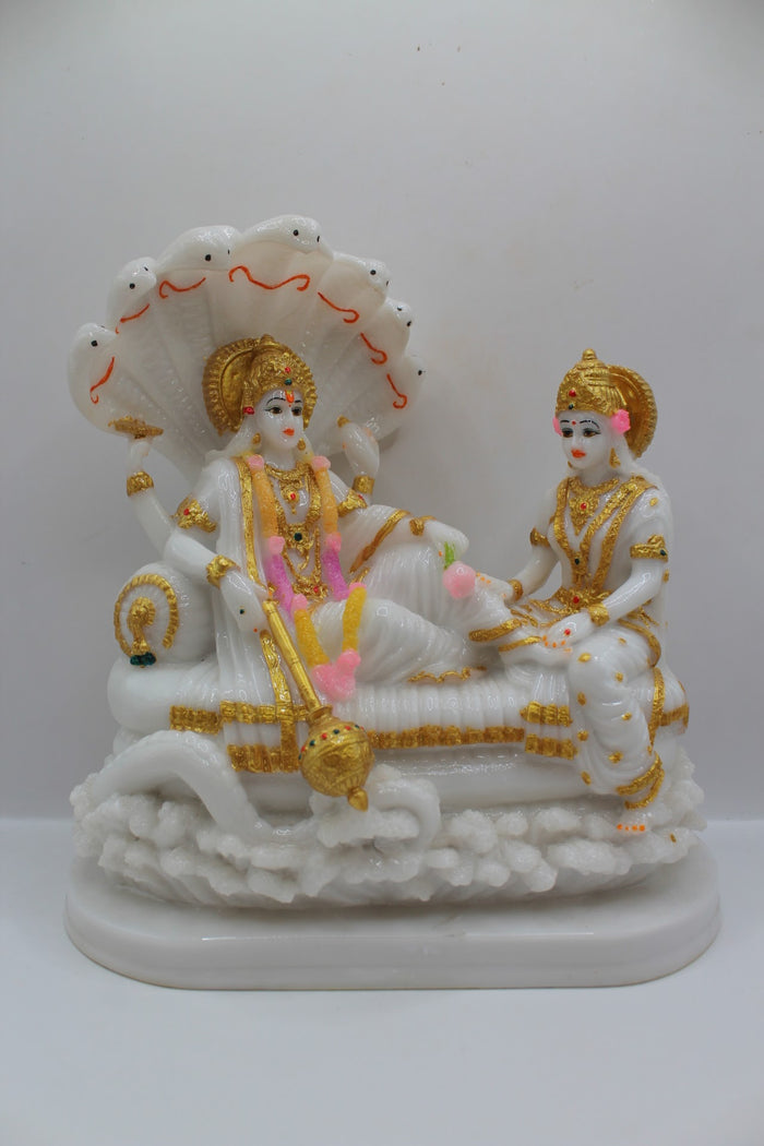 White and gold resin Vishnu Laxmi murti on Sheshnaag, front view
