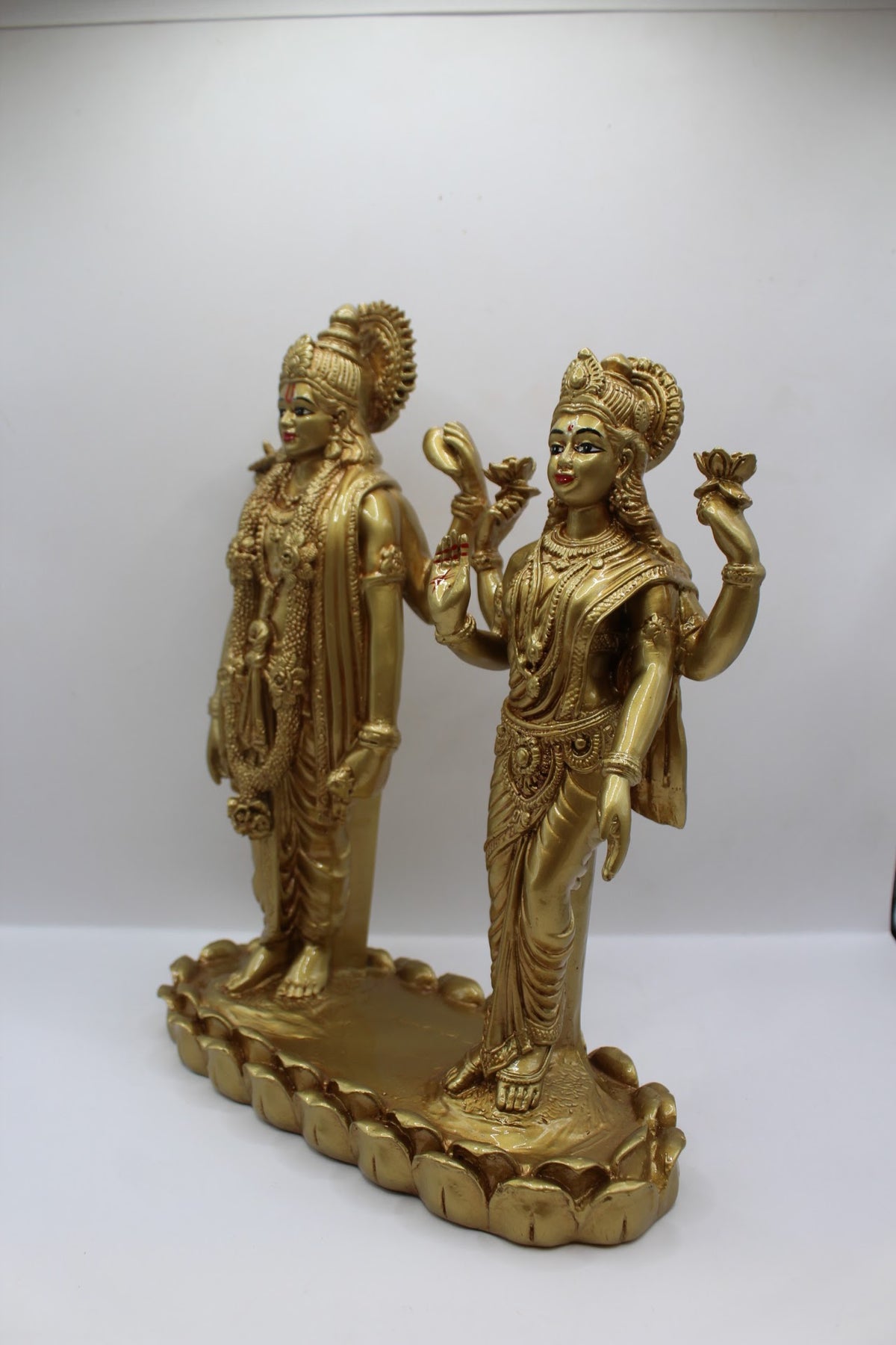 Gold resin Vishnu Laxmi murti, standing pair, right side view