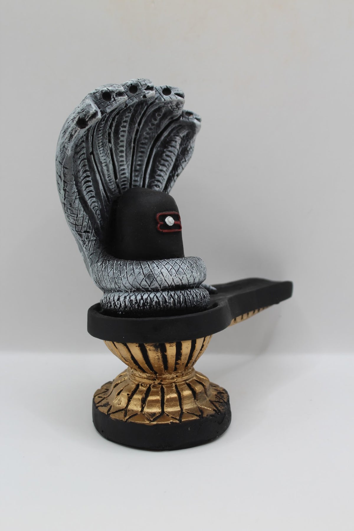 Black resin Shivling with Sheshnaag, left side view