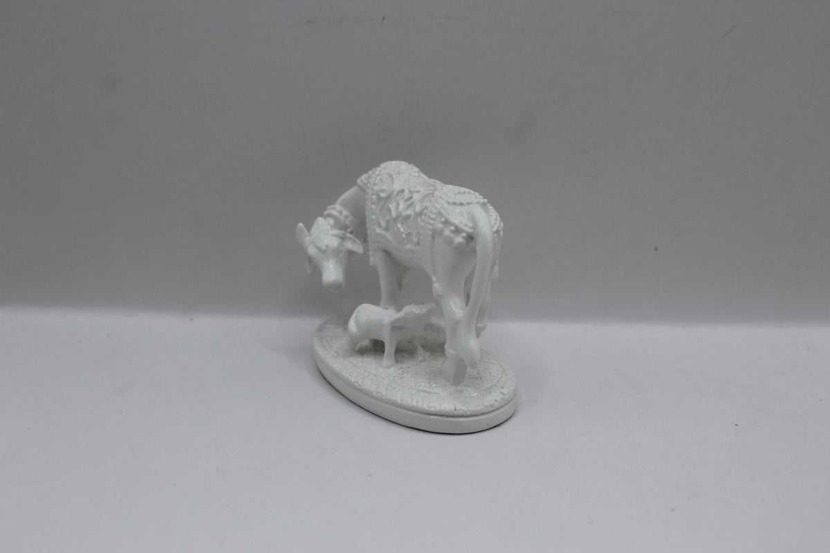 Small white resin cow and calf statue, right side view