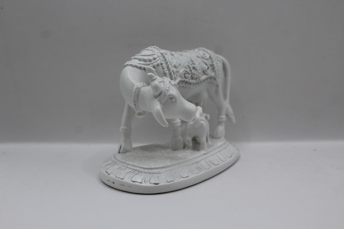 White resin cow and calf statue, left side view