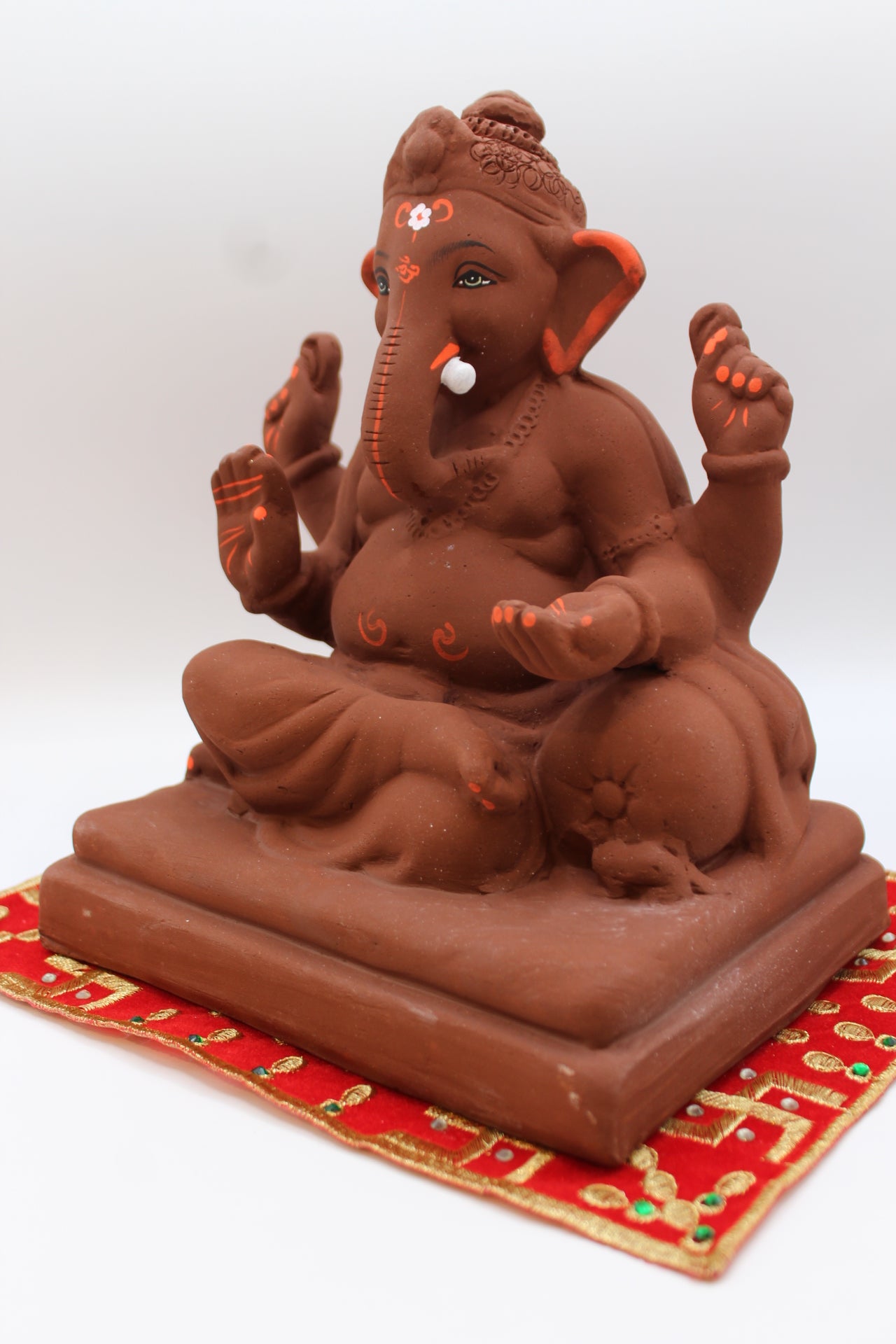 Natural terracotta eco-friendly 8 inch Ganesh Visarjan idol with topknot – detail view