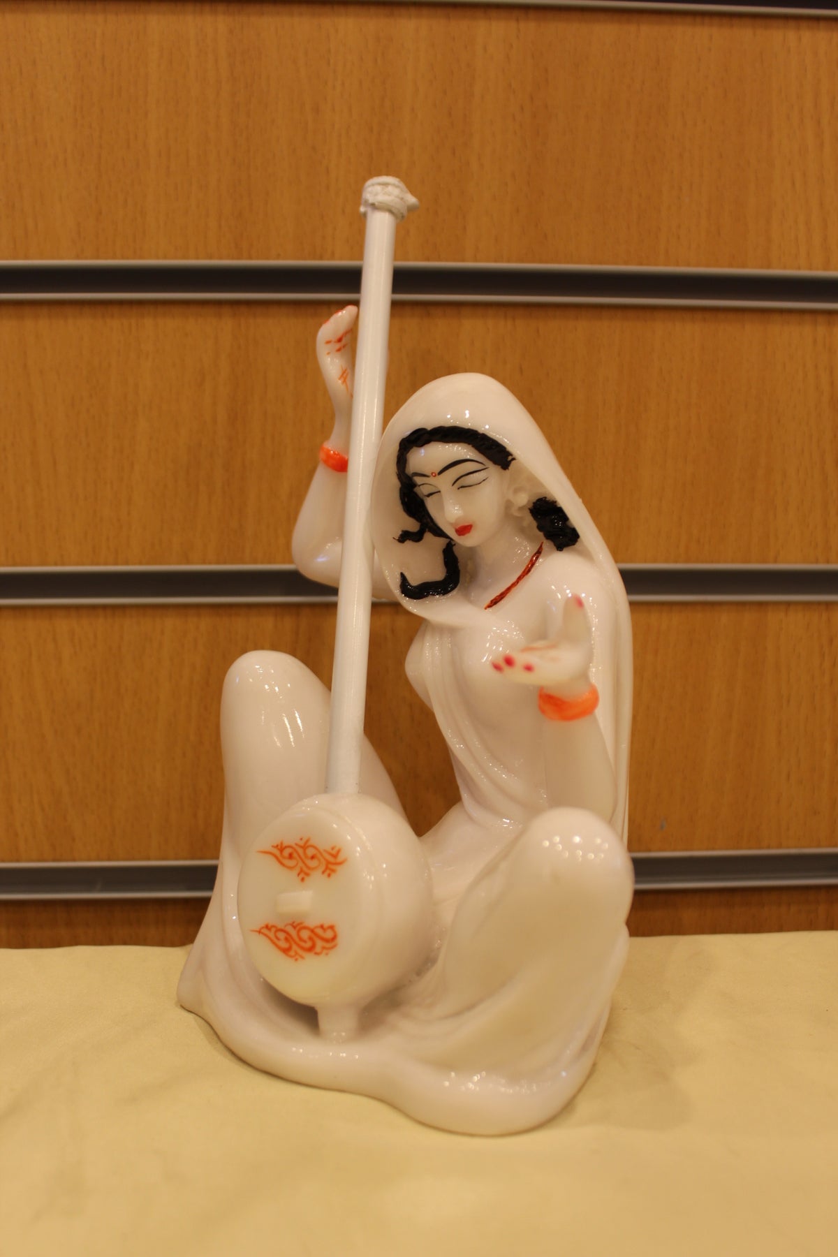 Resin/Fibre Mira Bai Statue – Seated with Tanpura, White – 10 inch – Swirl Design – right side view