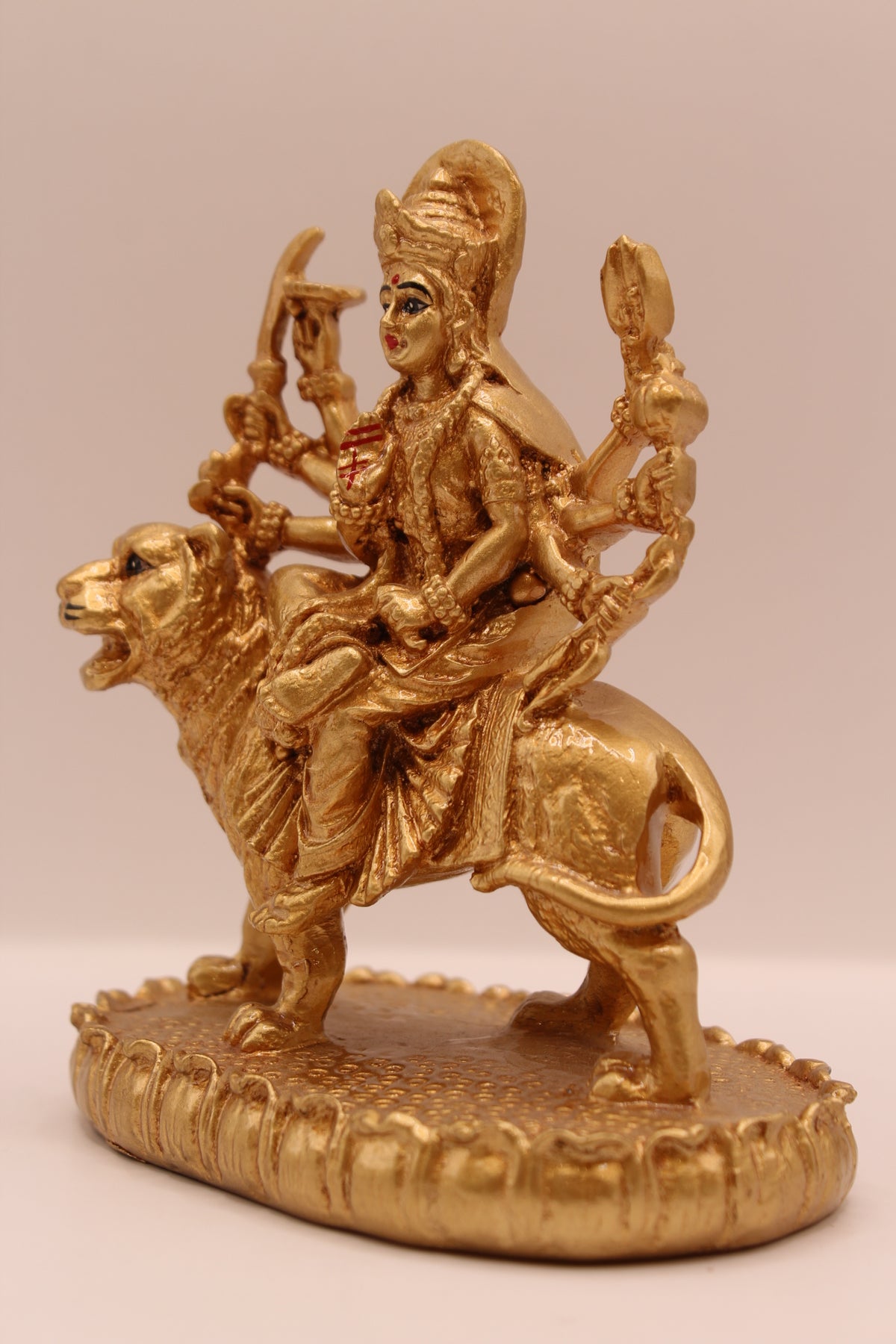 Gold Ambe Maa on lion statue, right side