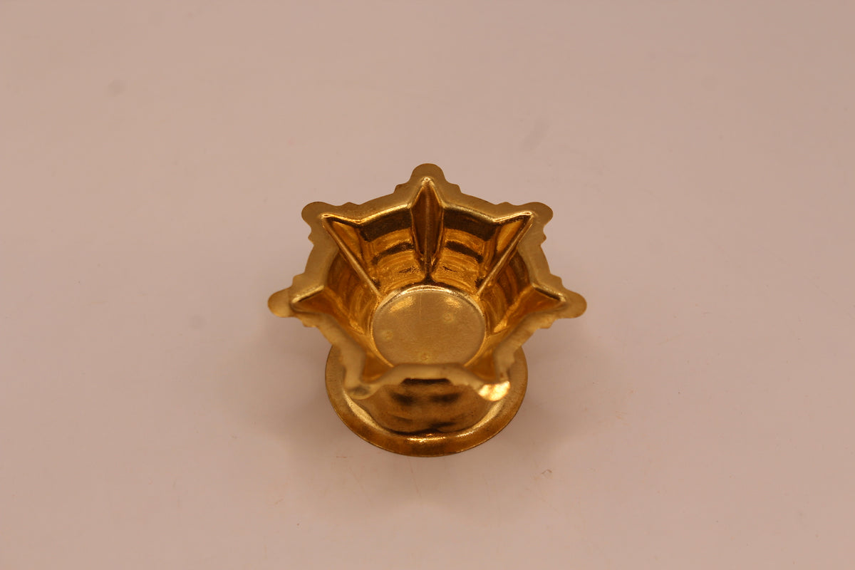 Small gold metal diya, front