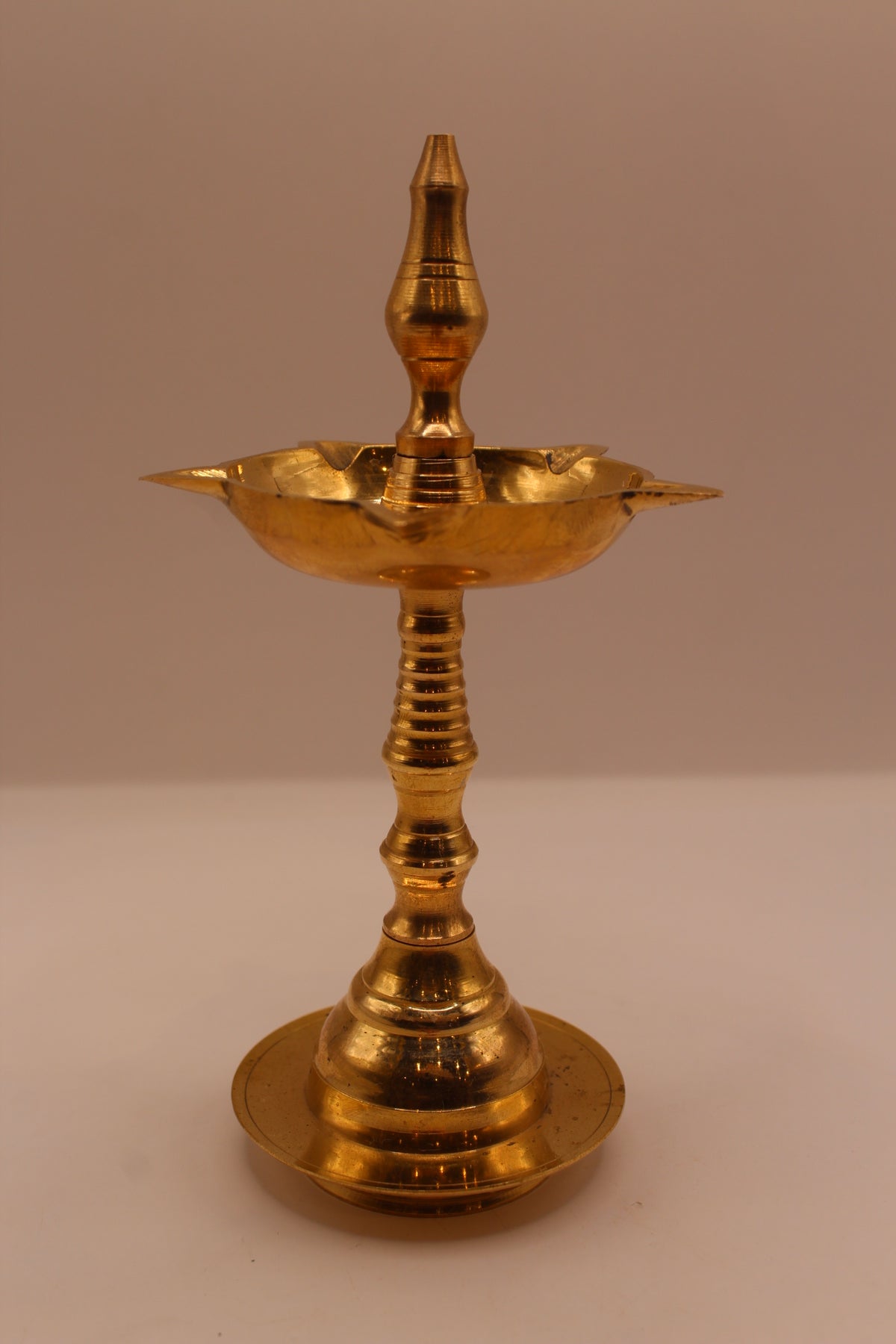 Wide brass samai diya stand, front