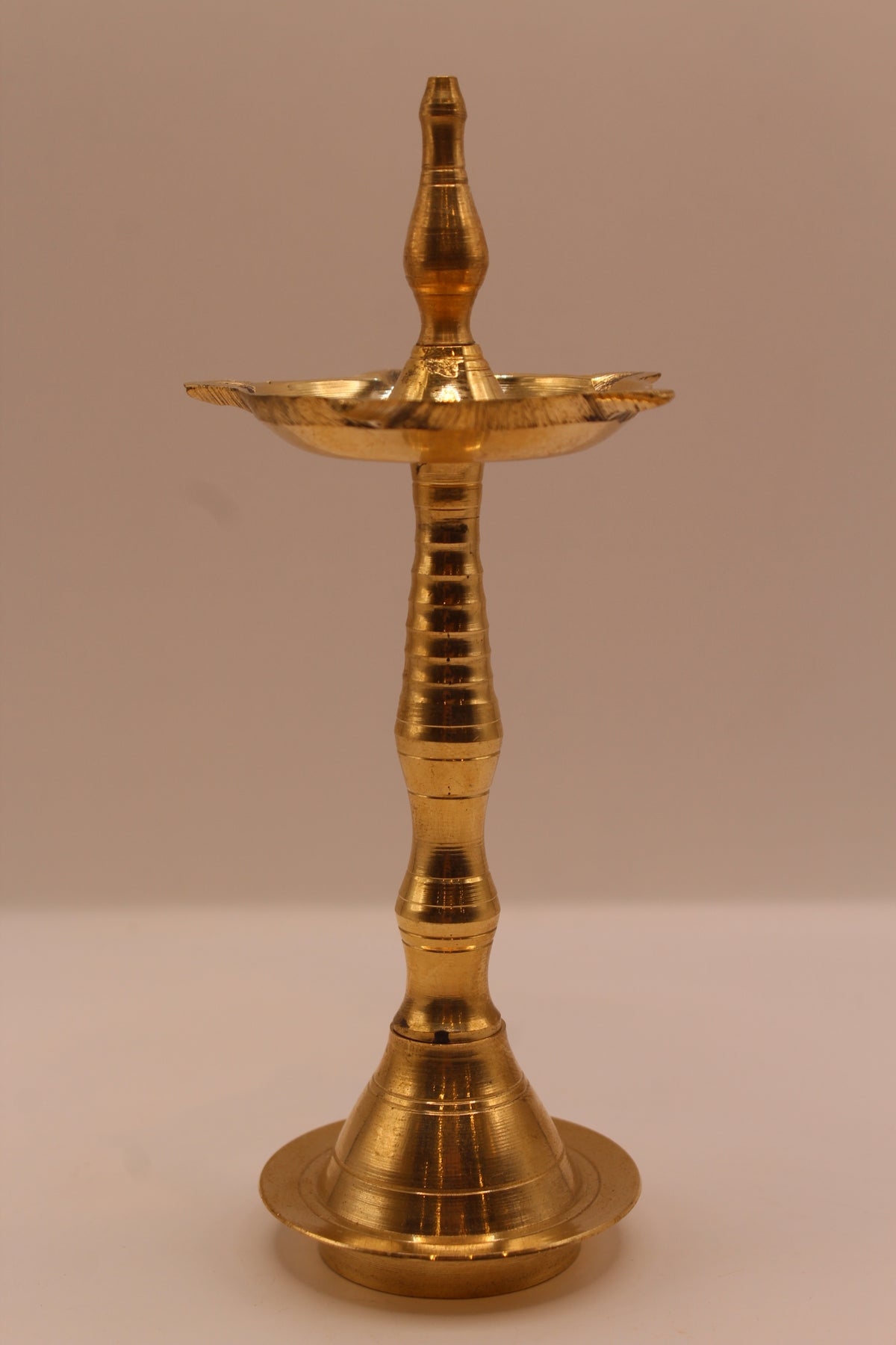 Slim brass samai diya stand, front