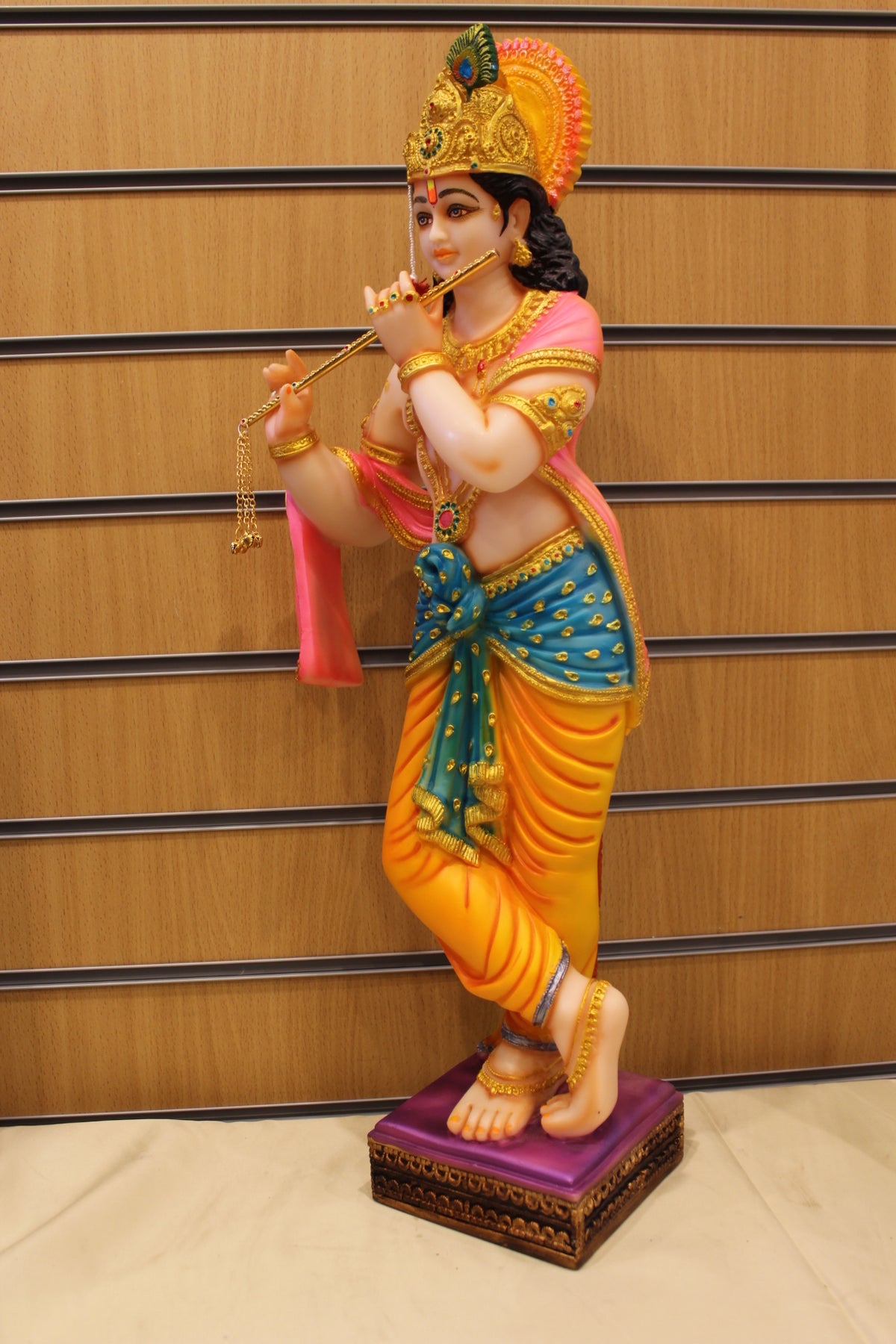 Resin/Fibre Krishna Statue for Home Temple – Playing Flute, 25 inch – Orange & Teal – right side view