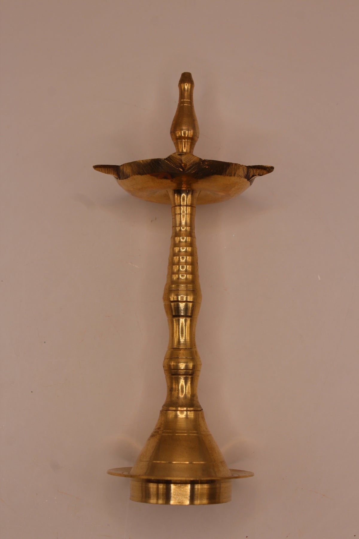 Slim brass samai diya stand, left side
