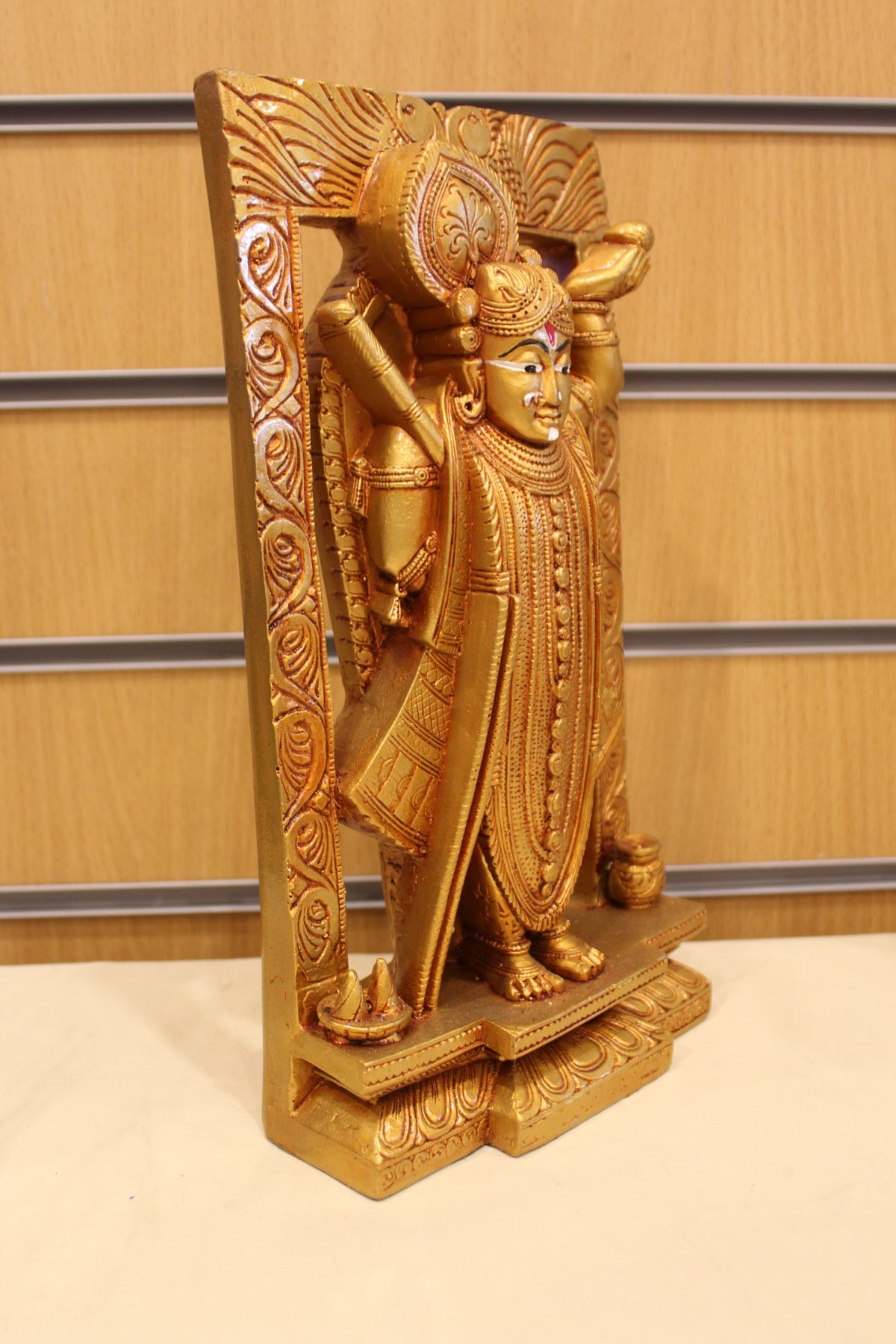 Resin/Fibre Shreenathji Statue for Home Temple – In Carved Frame, 11.5 inch – Gold – left side view