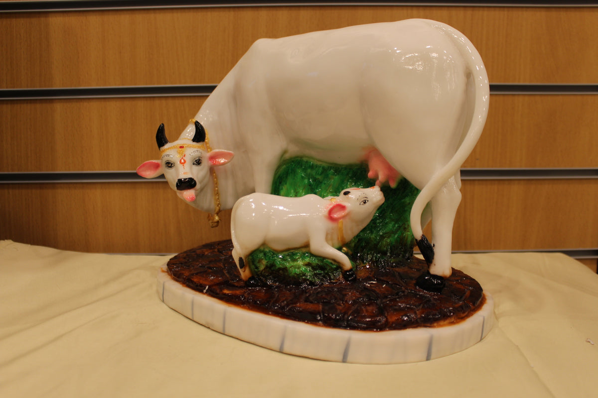Resin/Fibre Kamdhenu Cow and Calf Statue – White on Grass Base, 10 inch – right side view