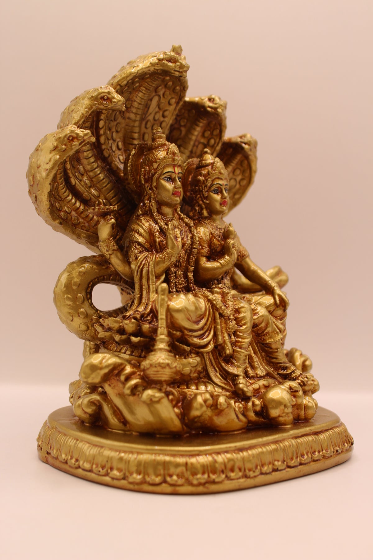 Gold Vishnu Laxmi on Sheshnag statue, left side