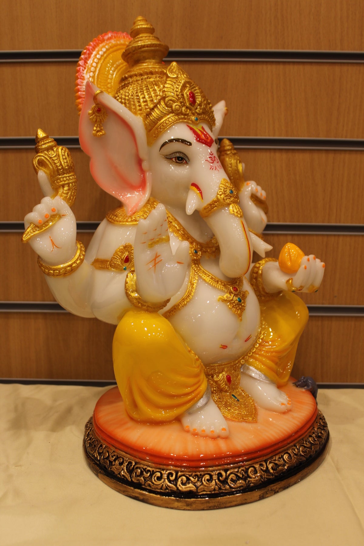 Resin/Fibre Ganesh Statue for Home Temple – Seated with Modak, 16 inch – Yellow Dhoti – left side view