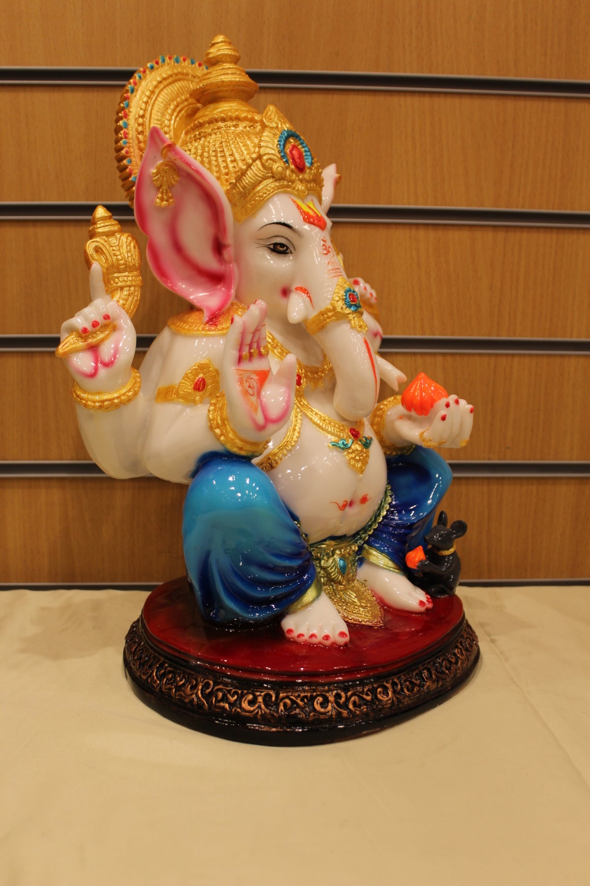 Resin/Fibre Ganesh Statue for Home Temple – Seated with Modak, 16 inch – Blue Dhoti – left side view