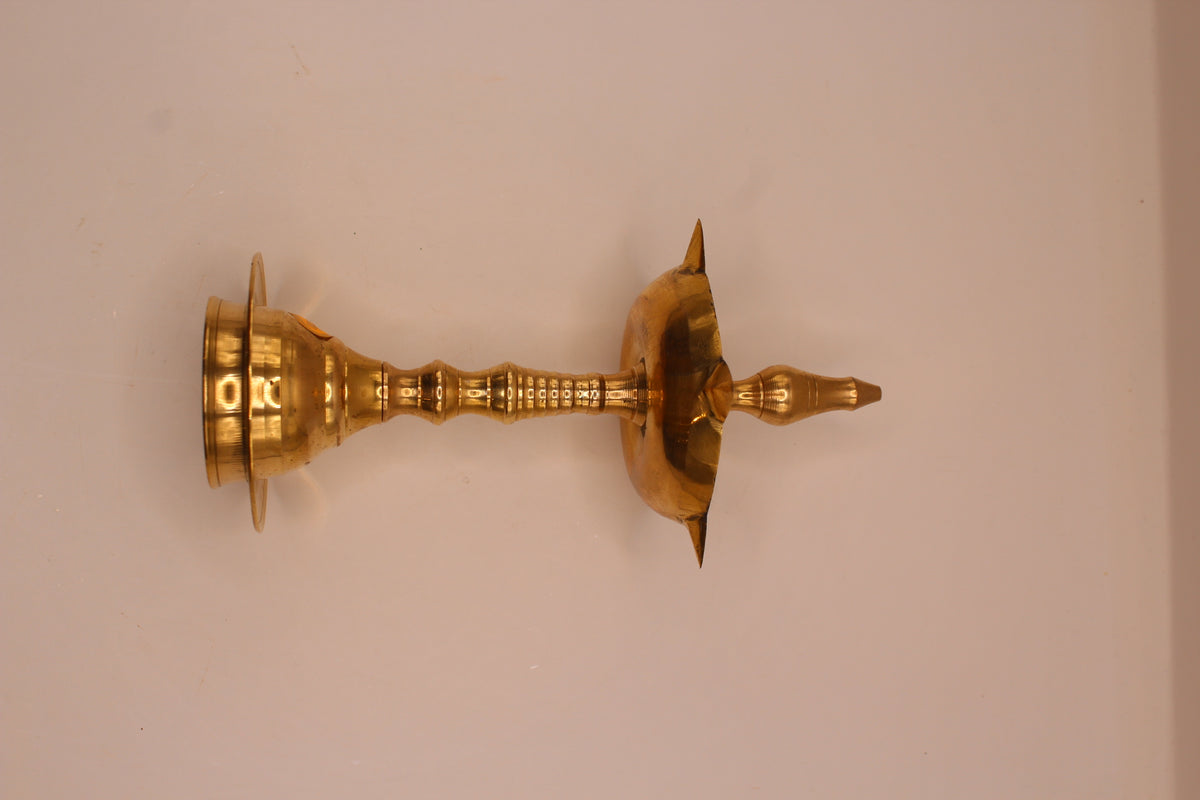 Wide brass samai diya stand, side