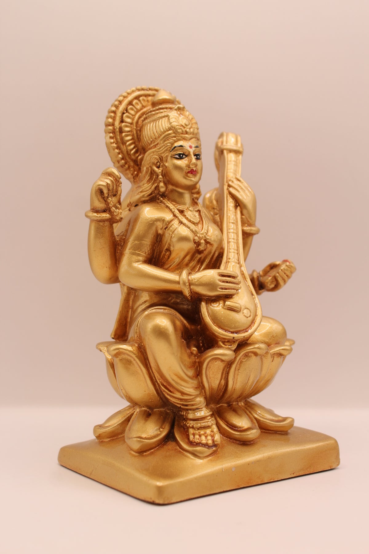 Gold Saraswati statue, left side