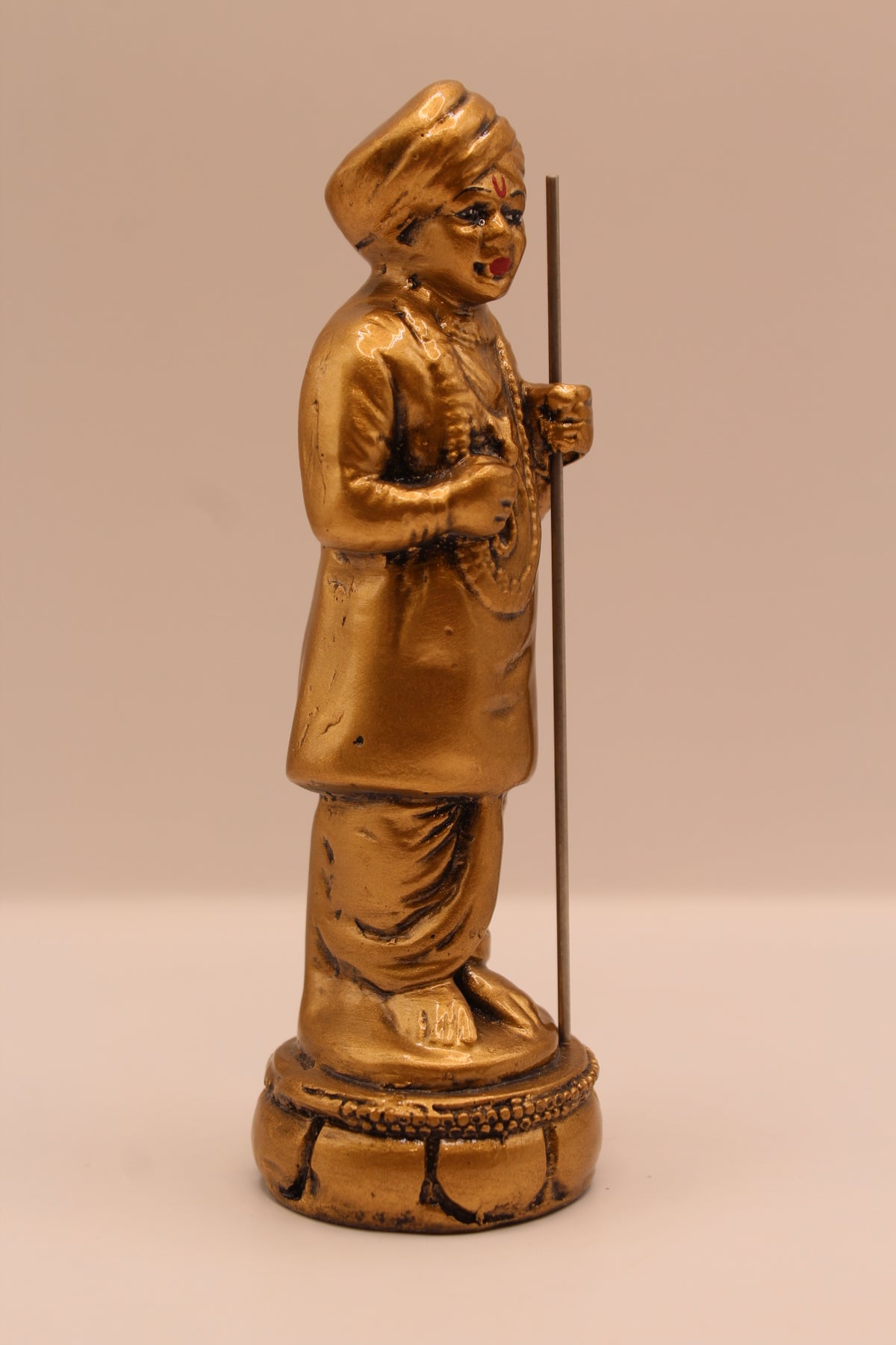 Gold Jalaram Bapa resin murti, left side