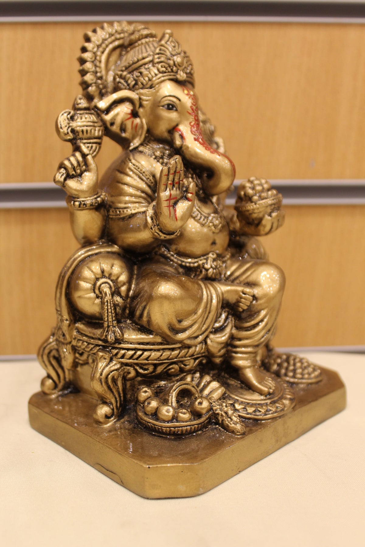 Resin/Fibre Ganesh Statue – Antique Gold, Small, 6 to 7 inch – Seated on Throne – 7 inch – left side view