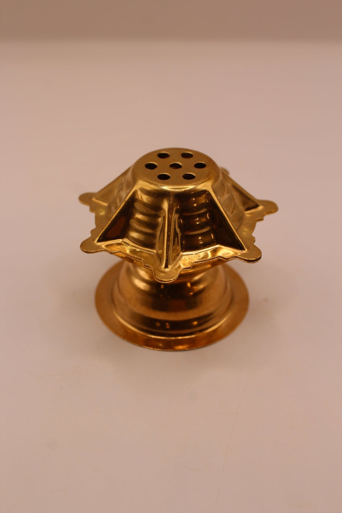 Small gold agarbatti stand, front